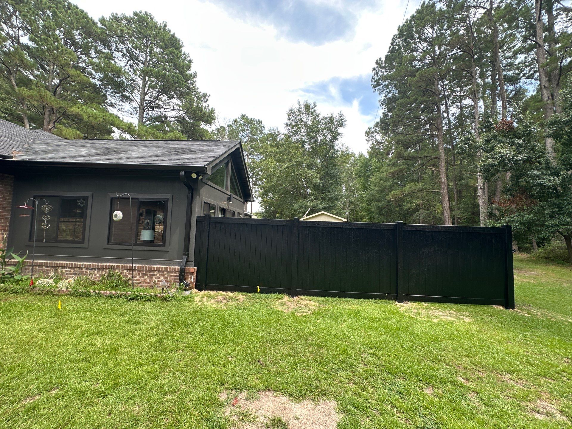 Black Vinyl Privacy Fence with Puppy Picket Aluminum Installation in Roseboro by Superior Fence and Rail