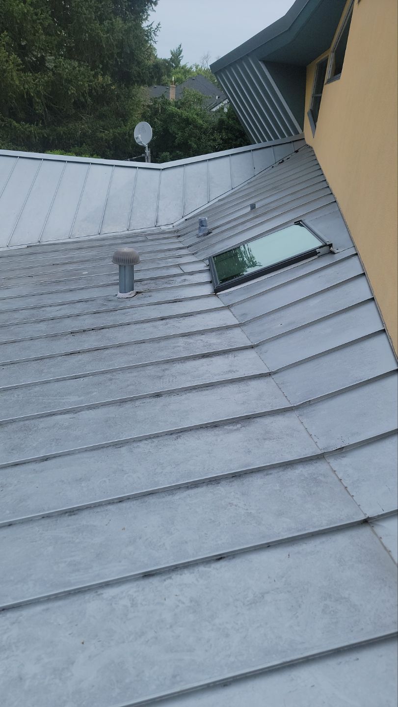 roof washing using Algaecide, soft wash soap by Northern Power Washing LLC.
