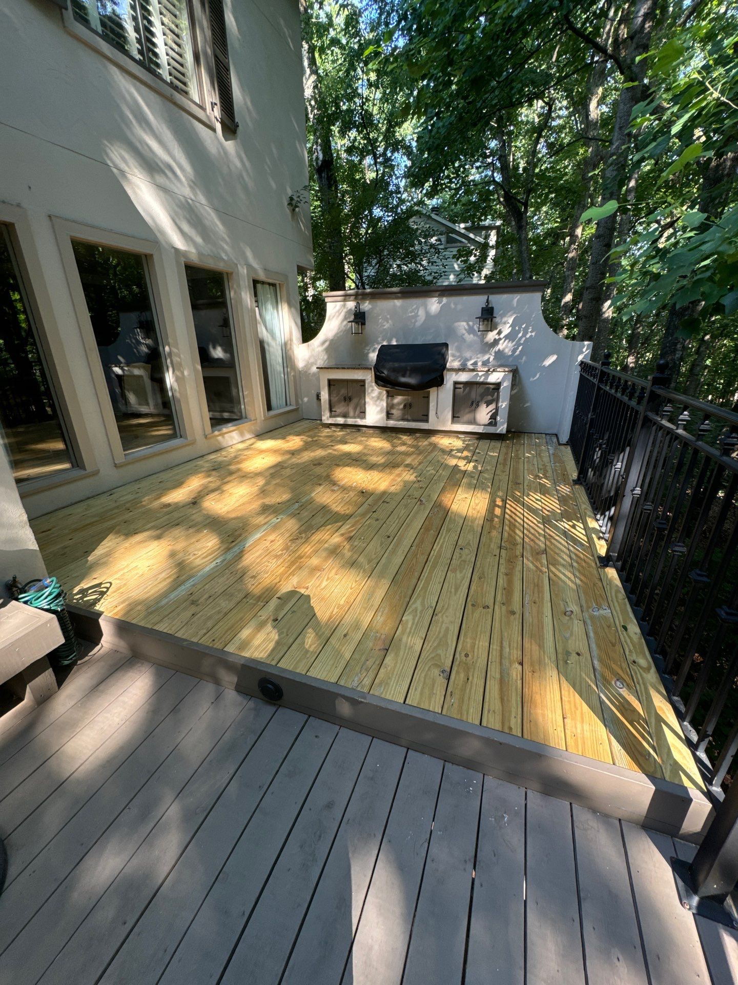 Custom Tiered Composite Deck and Covered Porch in Alpharetta by Swift Home Renovations