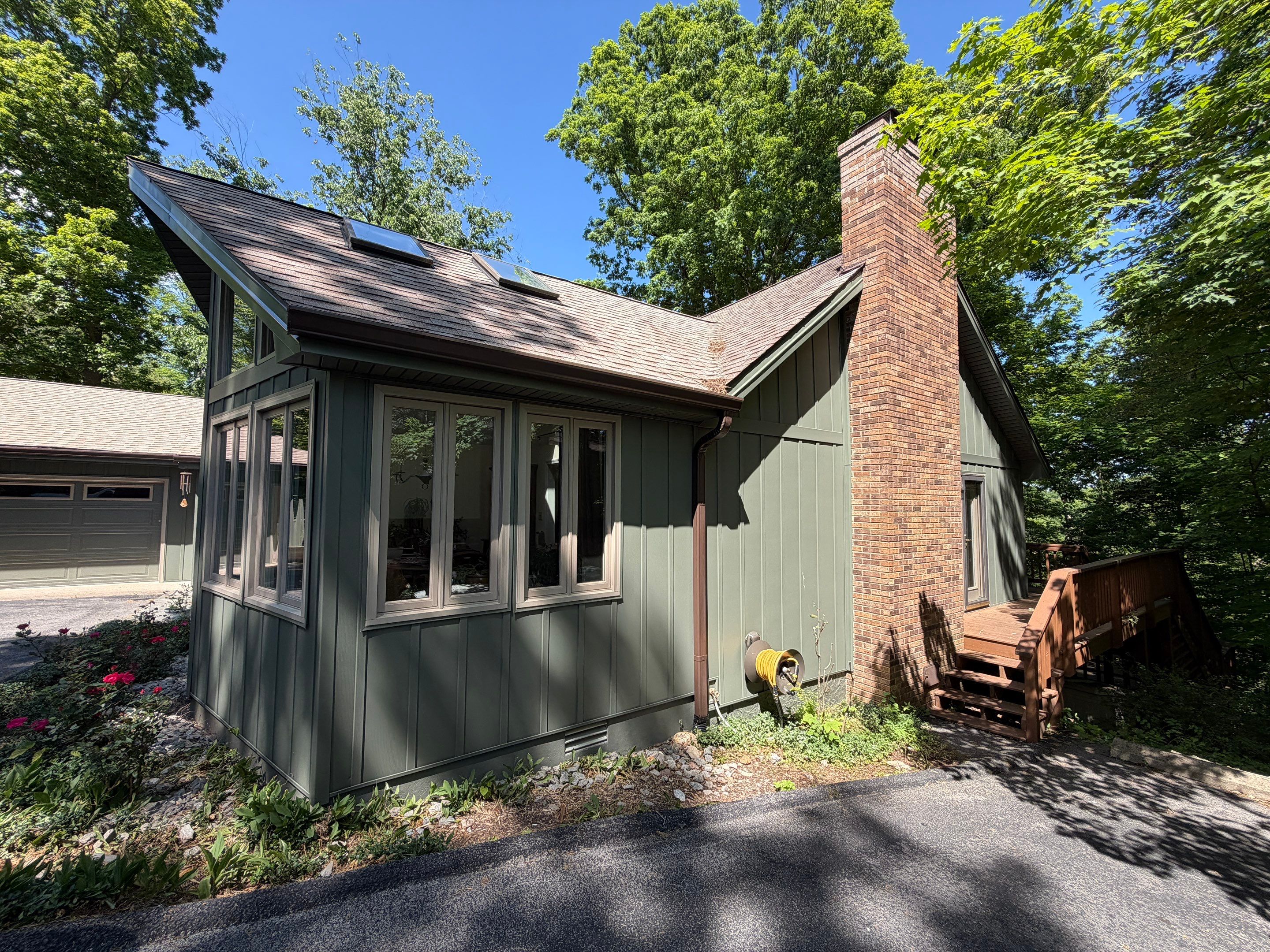 Deep Moss Board and Batten Siding Transformation in Danville by Stout Exteriors
