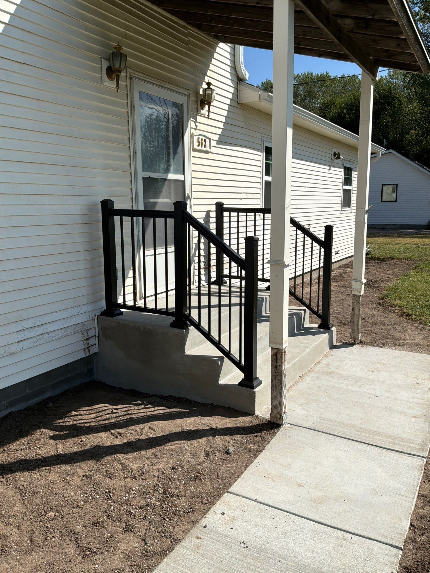 New Concrete Sidewalk, Steps & Railing in Kearney by Loyal Nine