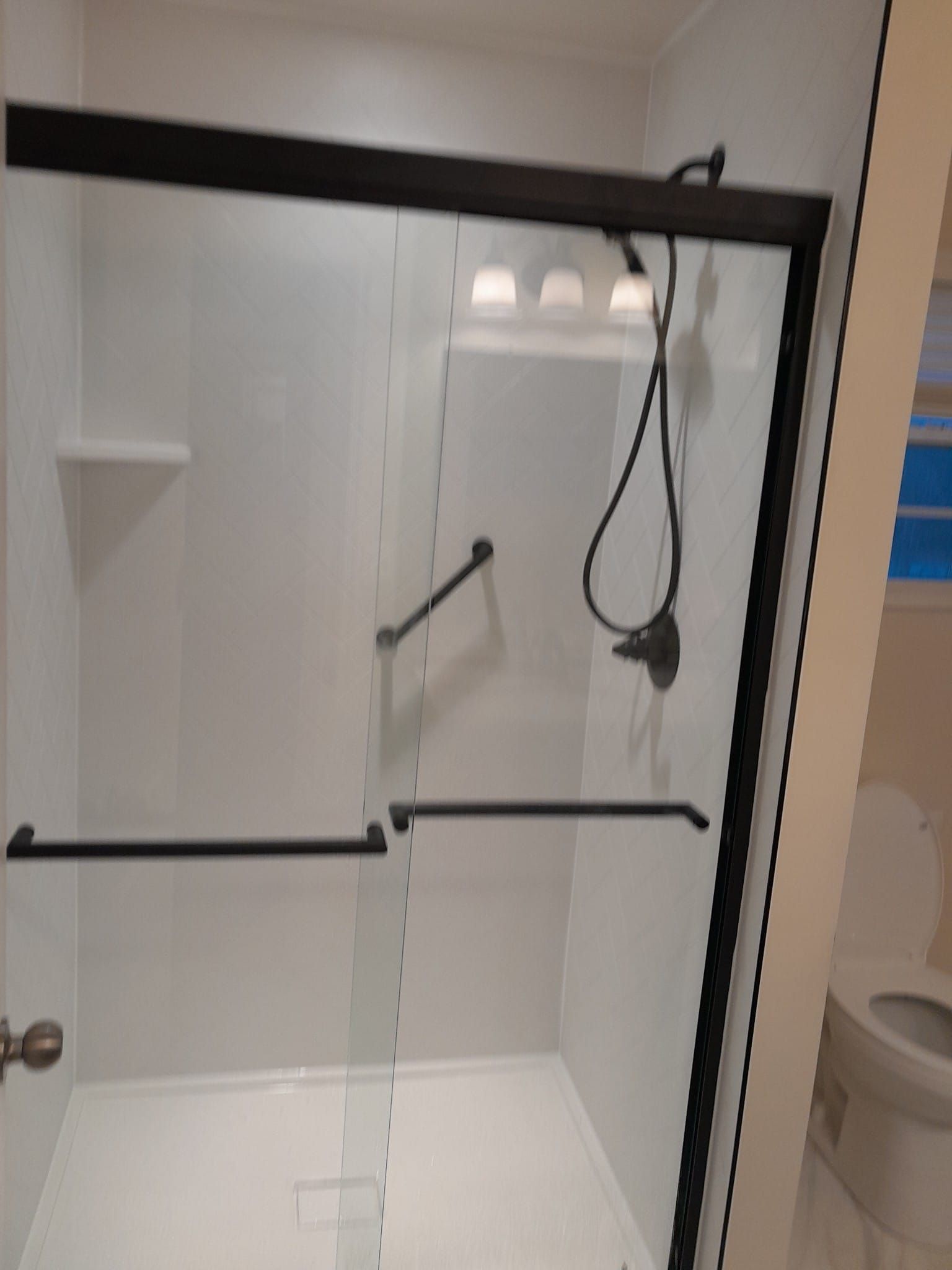 Shower remodel using Maintenance free wall system and shower pan with glass door by Window Depot of Annapolis