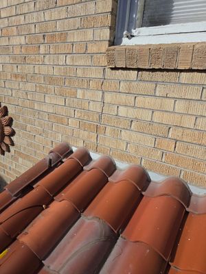 Low Slope Roof Coating / Broken Tile Replacement