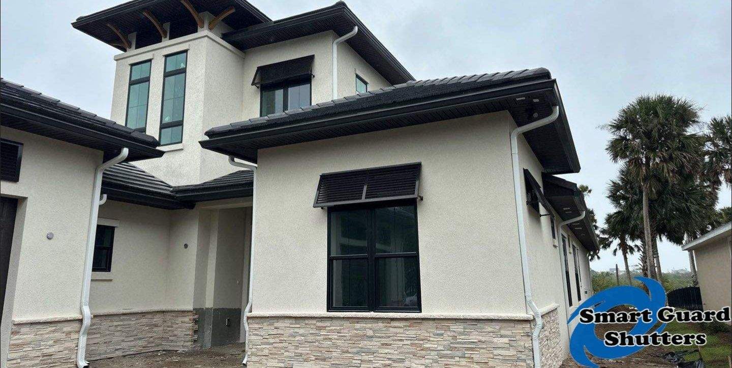 Decorative Bahama Shutters in Grey Brown by Smart Guard Shutters