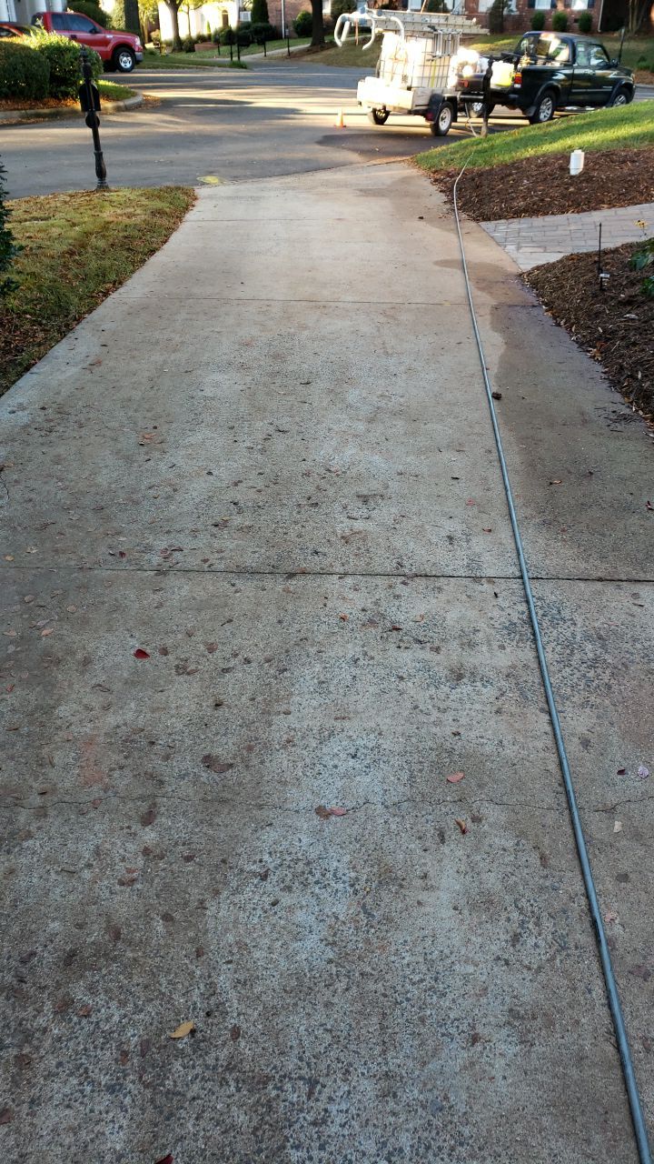 Driveway Clean using cleaner by Power Wash Masters LLC