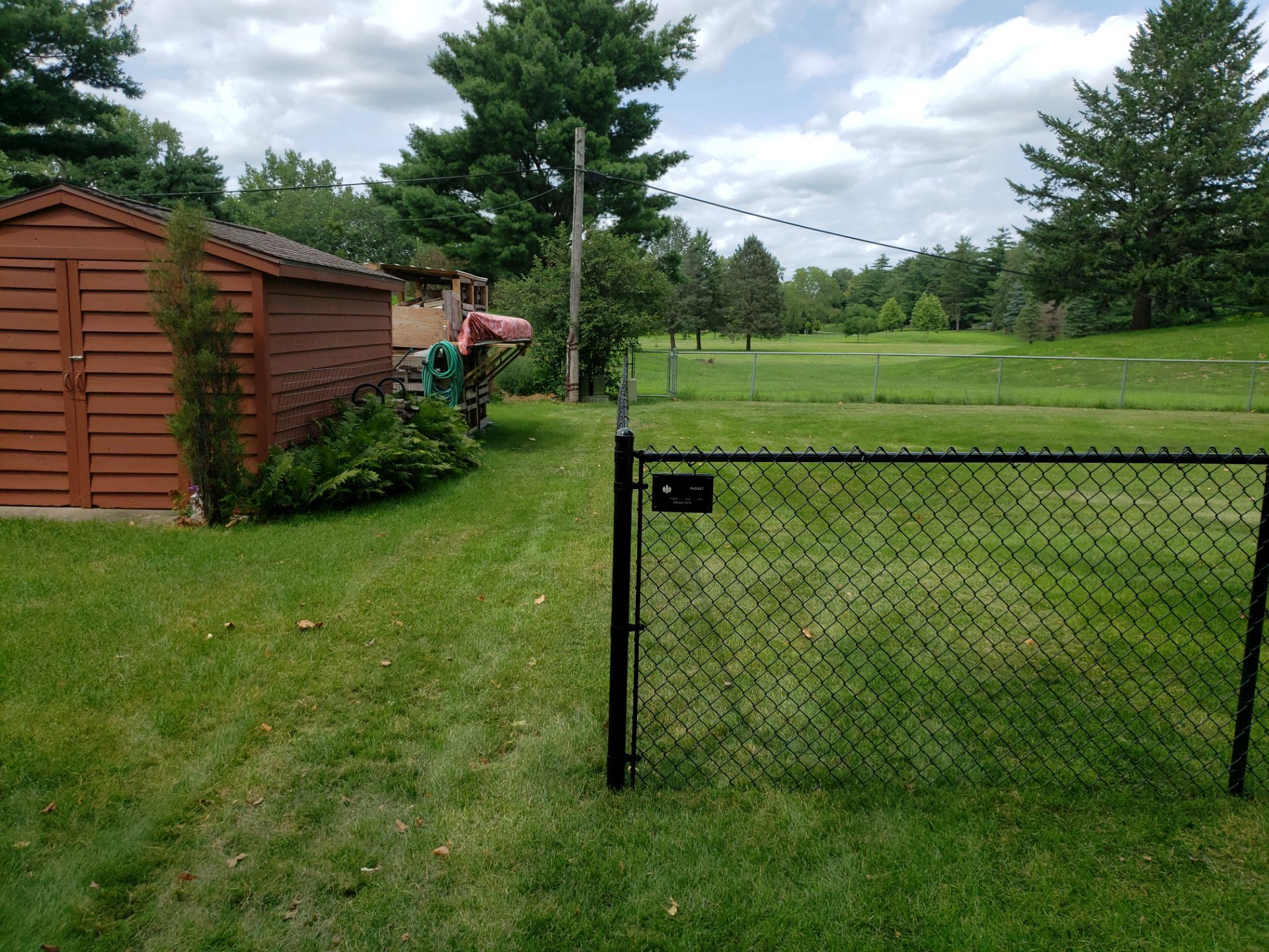Black Chain Link Fence Installation in Cedar Falls by Perfect Picket Fence and Stain