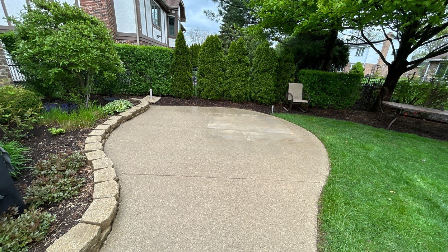 concrete patio and driveway cleaning by Northern Power Washing LLC.