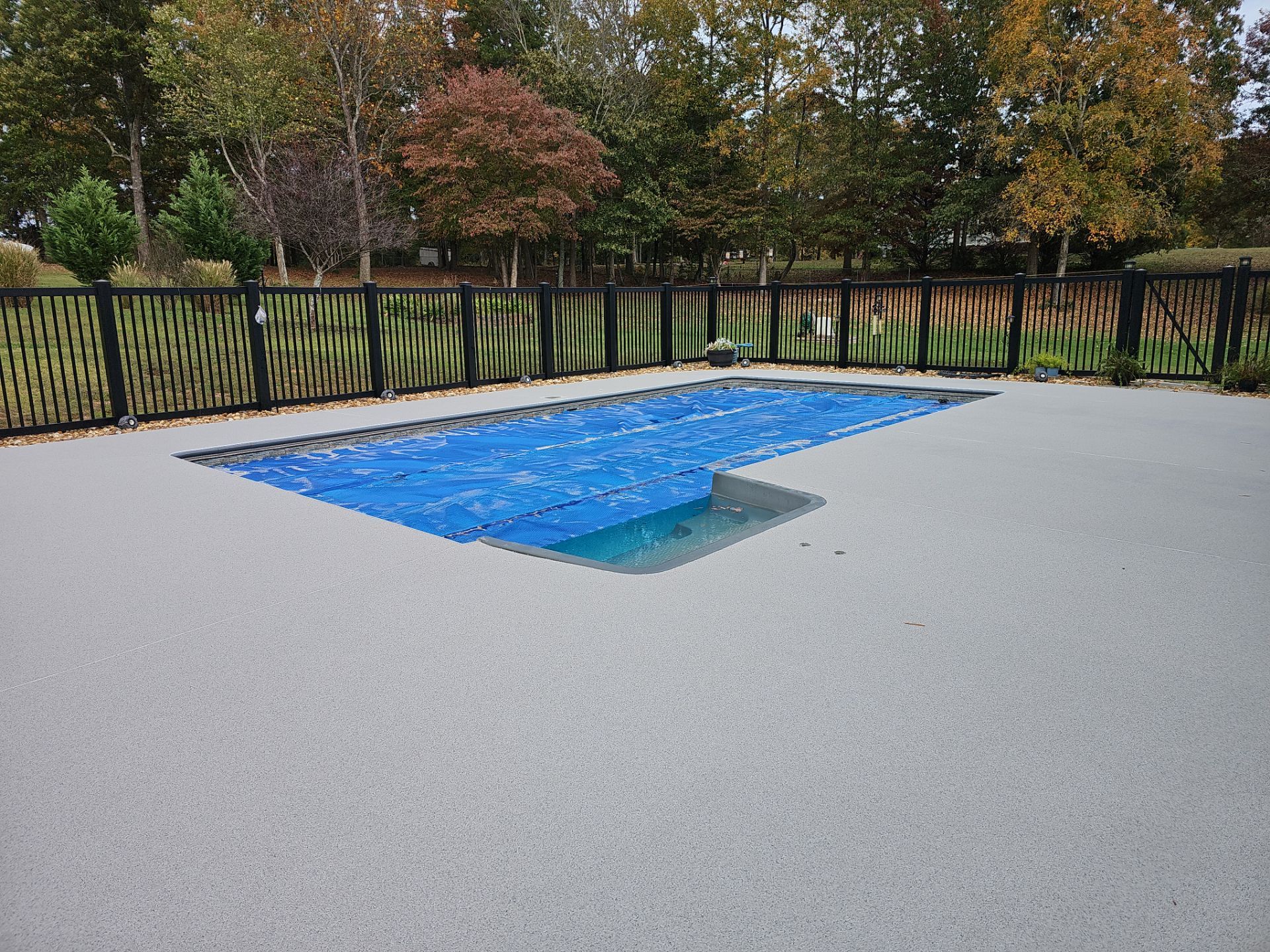 Pool Deck & Sidewalk using Quicksand & Obsidian by Elite Floor Solutions