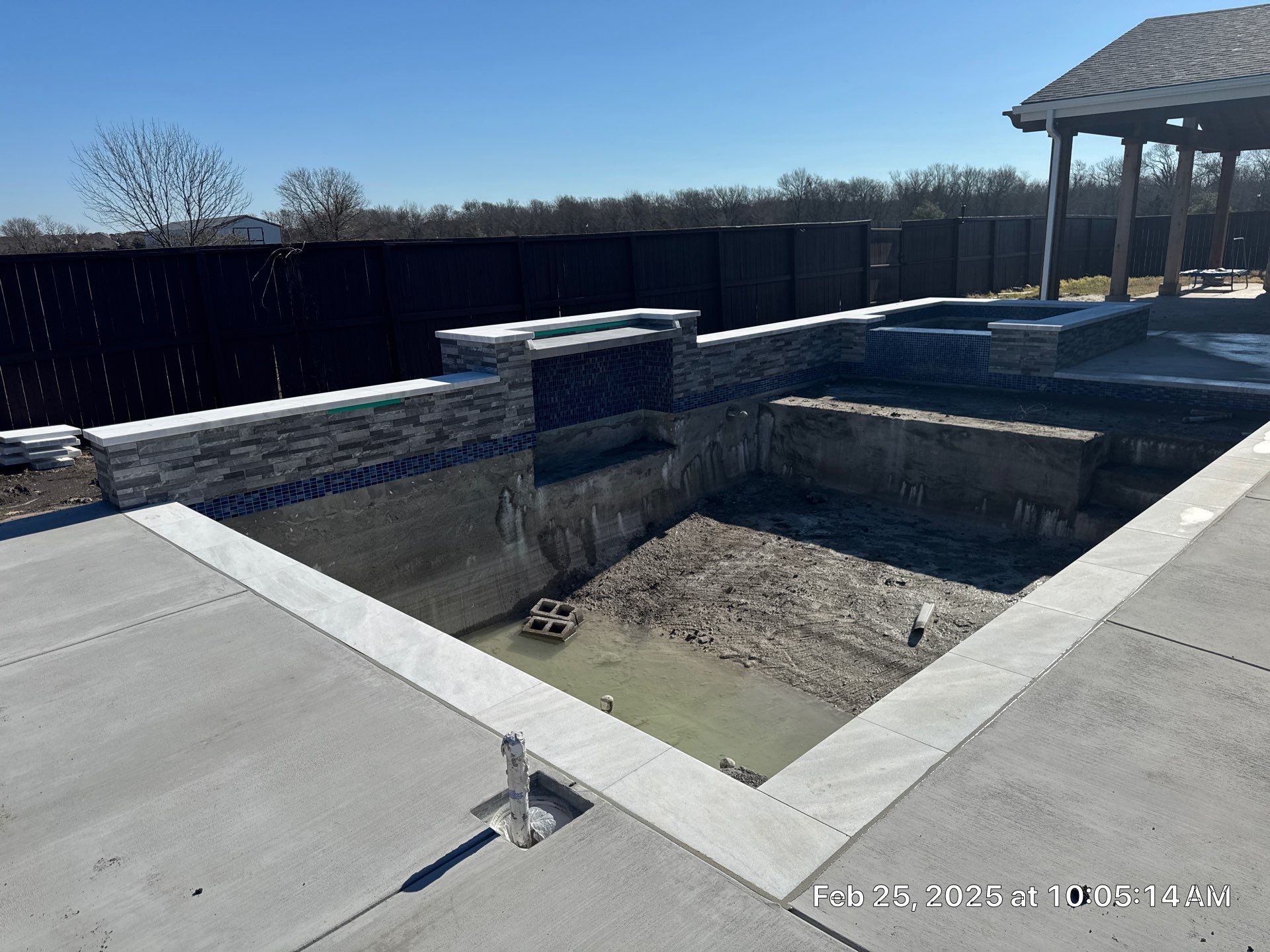 Geometric Pool and Spa with Stone Water Feature Wall by Pinnacle Pools and Spas - DFW