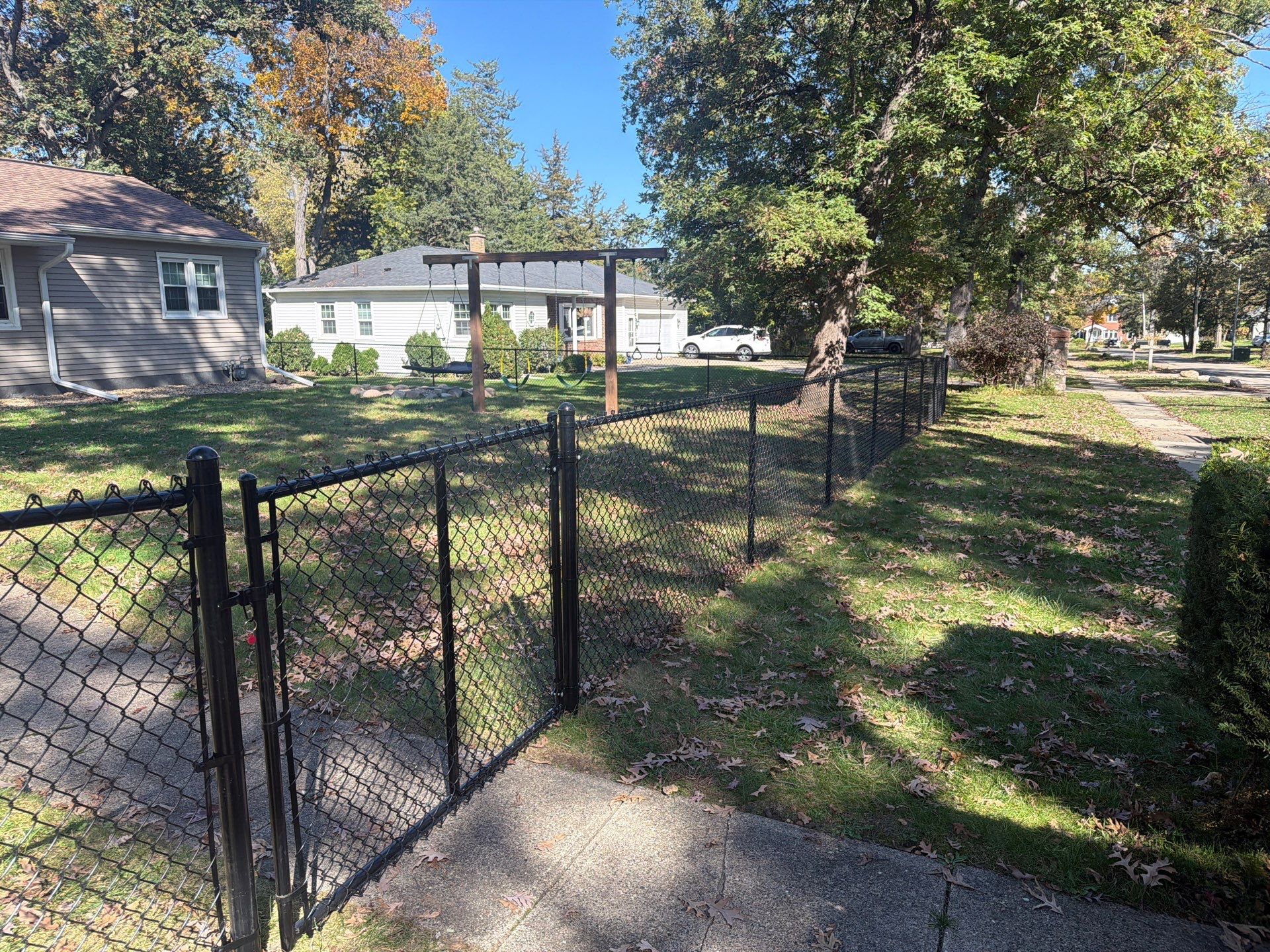 Residential Black Chain Link Fencing in Cedar Falls by Perfect Picket Fence and Stain