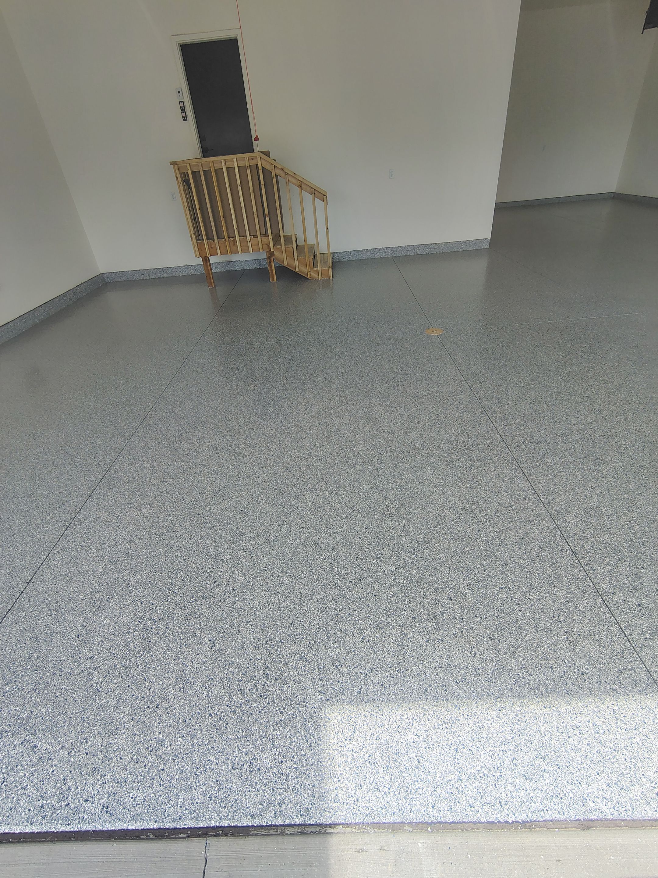 Sioux Falls Garage Floor Transformation with Gray Decorative Flake Coating by Select Painting, Coatings & Garage Cabinets