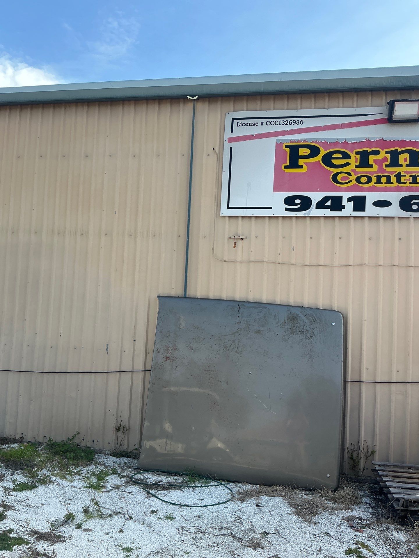 Black Aluminum Gutters with Matching Downspouts in Port Charlotte, FL by Gutter Professors