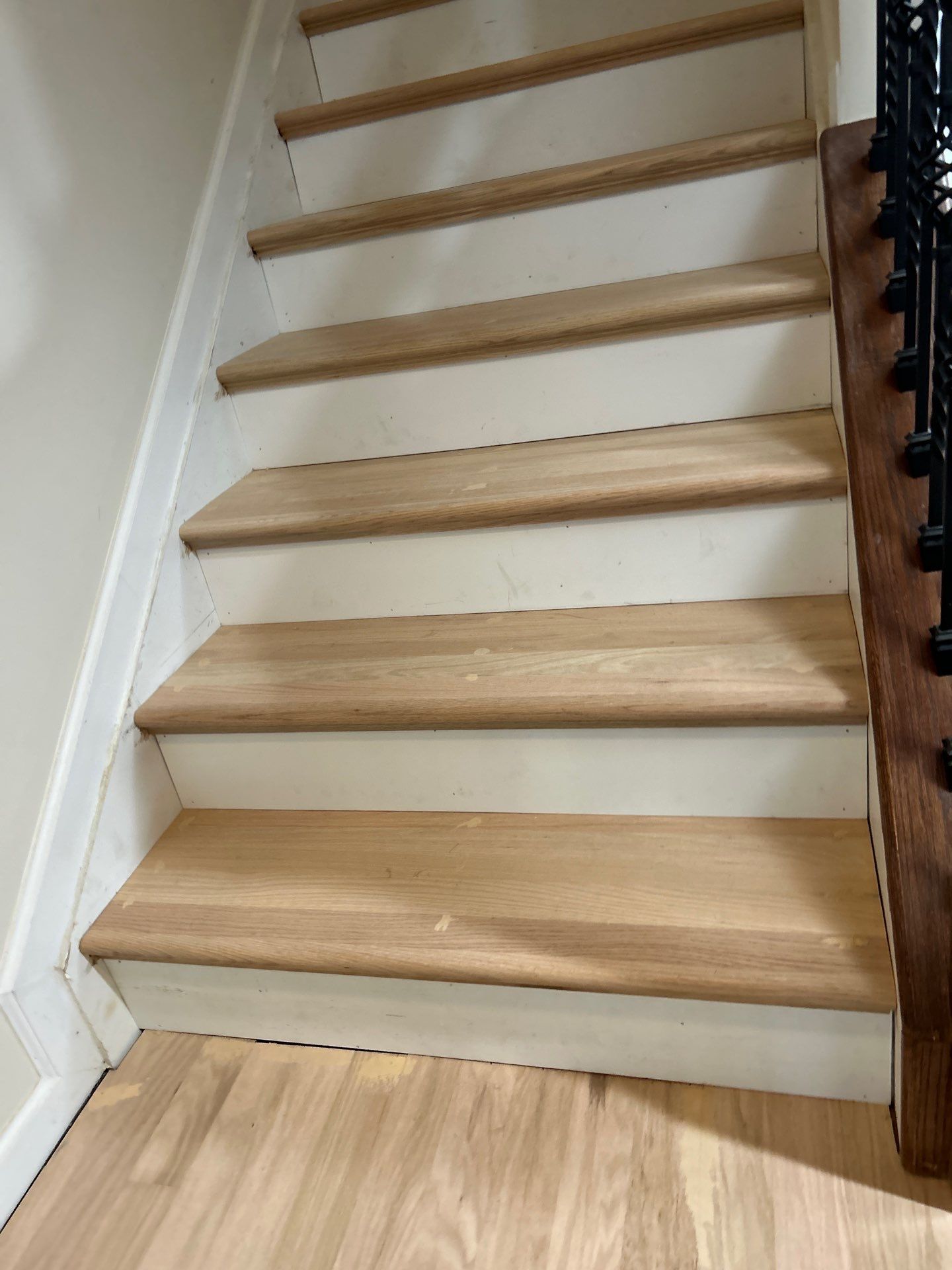 UPGRADE to solid oak stair treads by Footprints Floors of East Atlanta