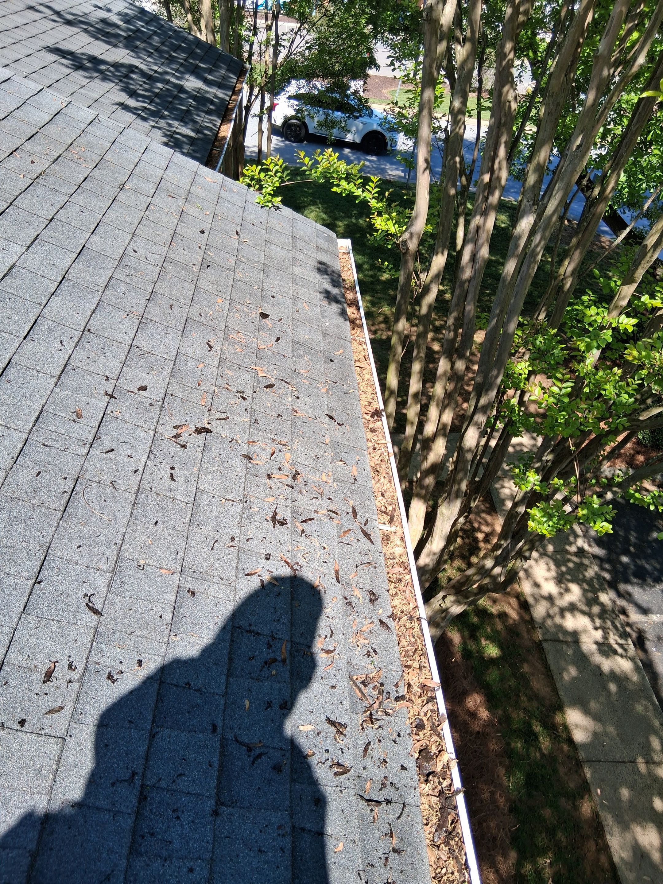 HOA gutter cleaning in Mooresville & Lake Norman, NC,before  photo showing full gutters.