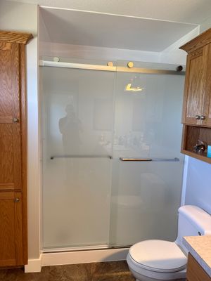 White Acrylic Bathtub and Frosted Glass Shower Door Installation in Beulah
