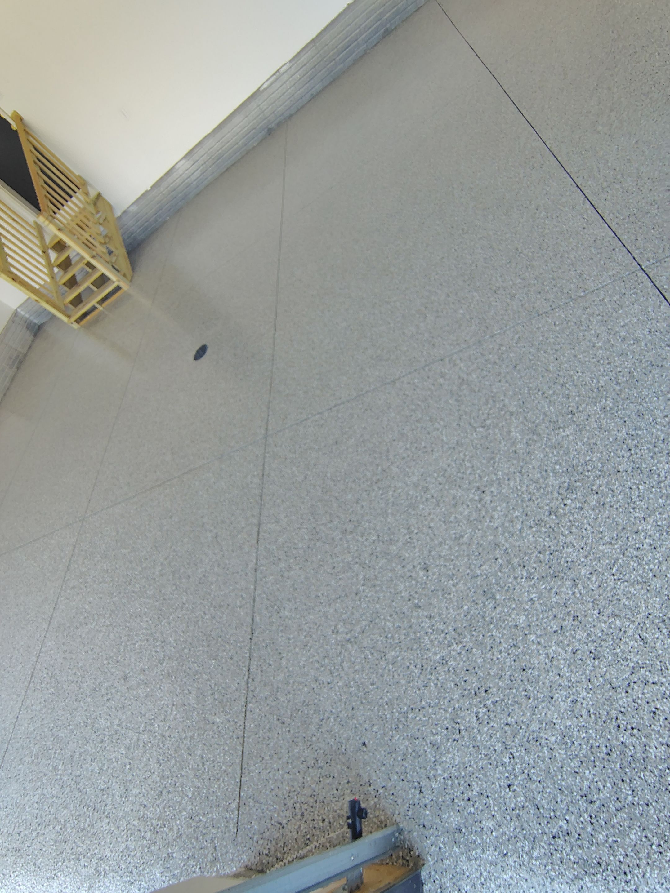 Cabin Fever Decorative Flake Garage Floor Coating in Sioux Falls by Select Painting, Coatings & Garage Cabinets