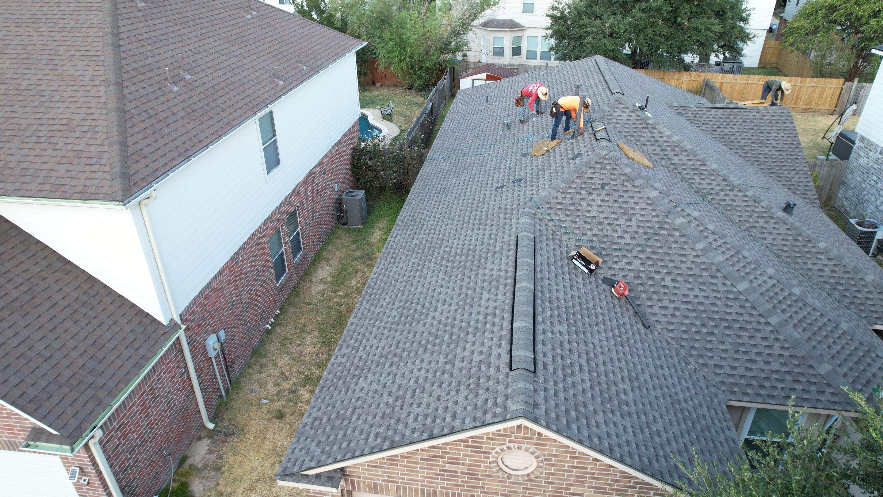 Full Roof Replacement on Two-Story Brick Home — Spring, TX by PL Roofing & SB Roofing, LLC.