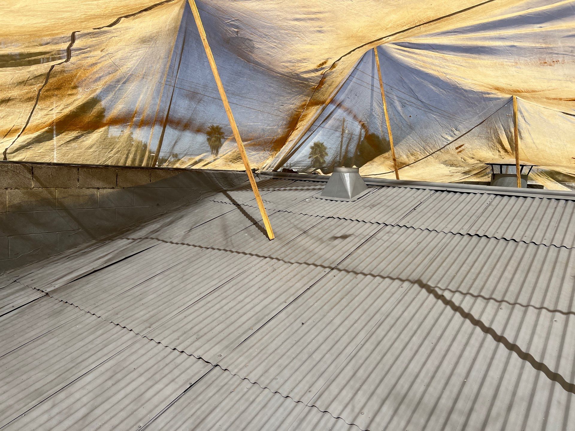 Spray foam and coatings using Conklin Benchmark/ PUMA XL acrylic coatings over metal and foam by Straight Edge Roofing Inc