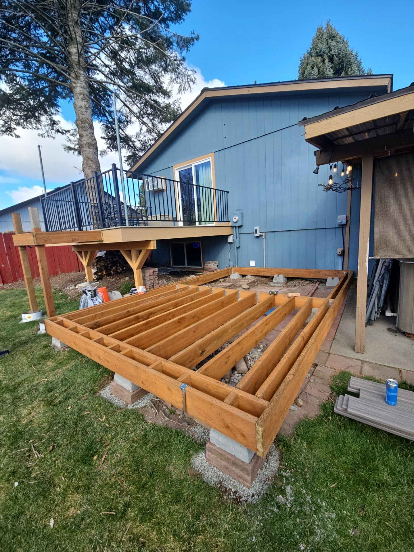 Add a platform deck below an existing elevated deck that was there prior by Home Helpers General Contracting