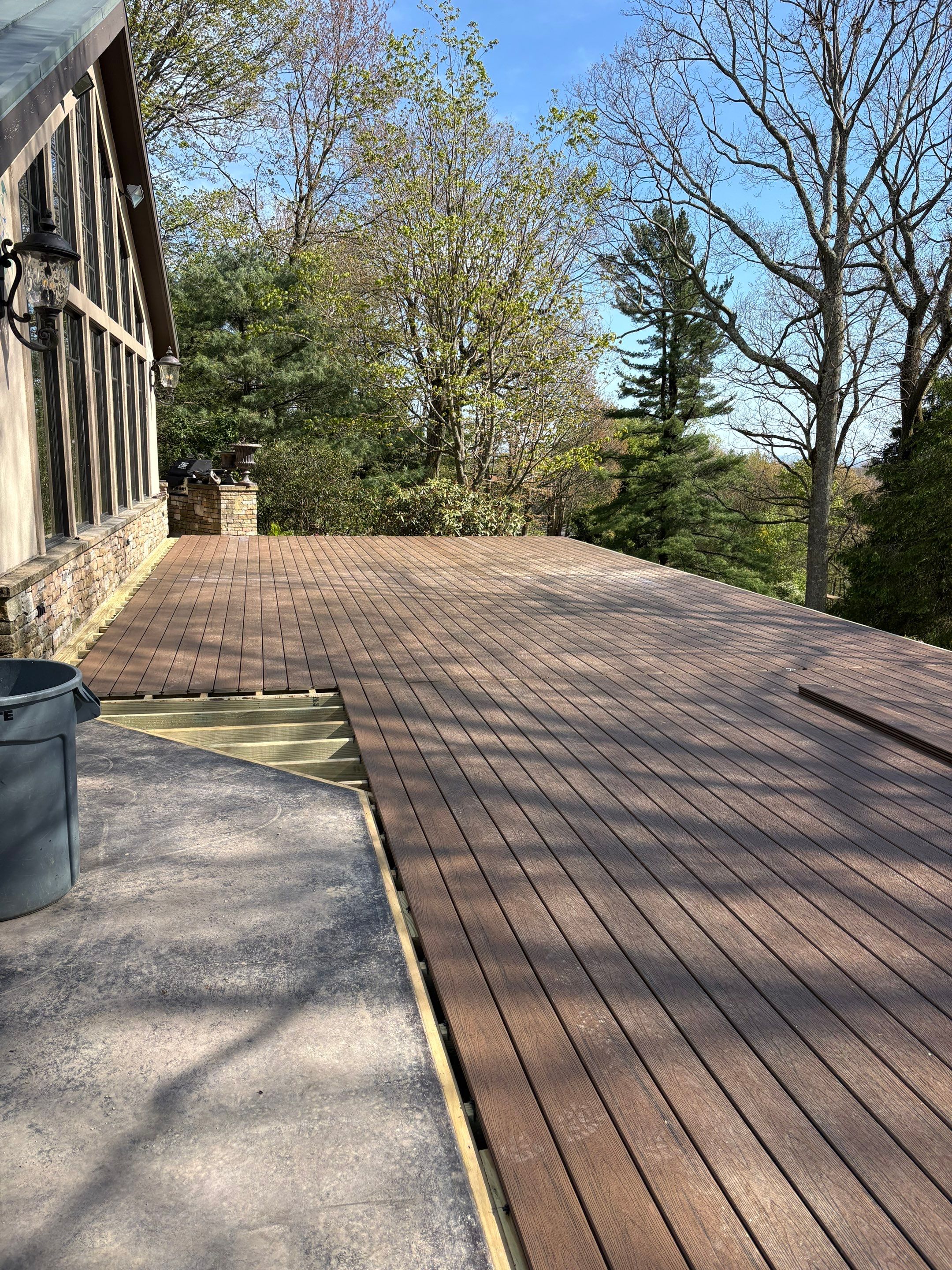 1500 sq/ft Composite Deck Build with Outdoor Kitchen in Champion by Cousins Roofing Siding & Decks
