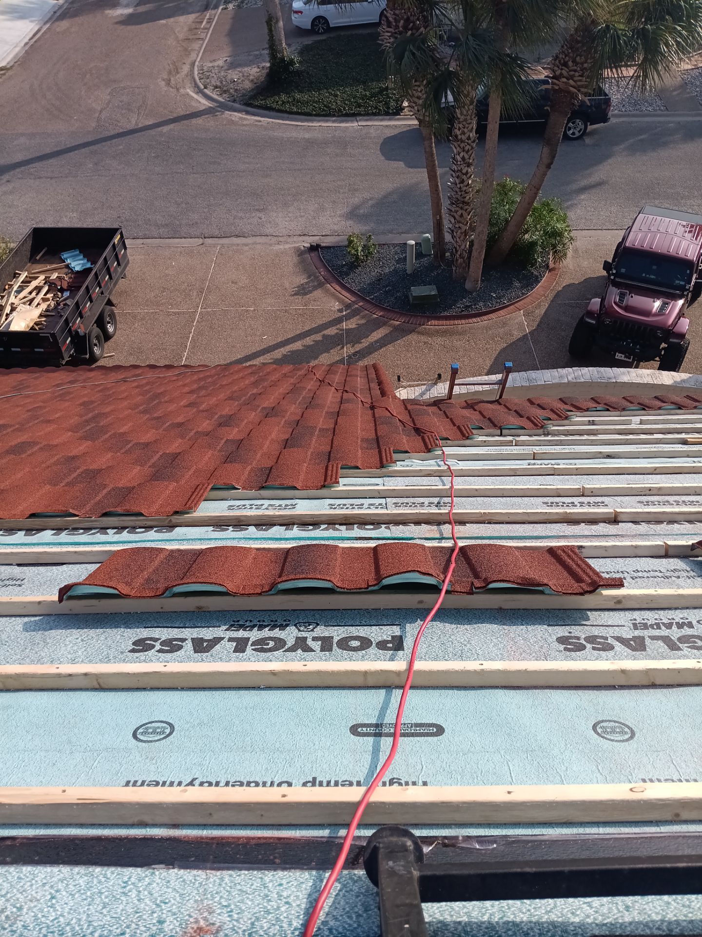 Off with the Tile and on with the TILCOR stone coated metal.  by Bayfront Roofing and Construction