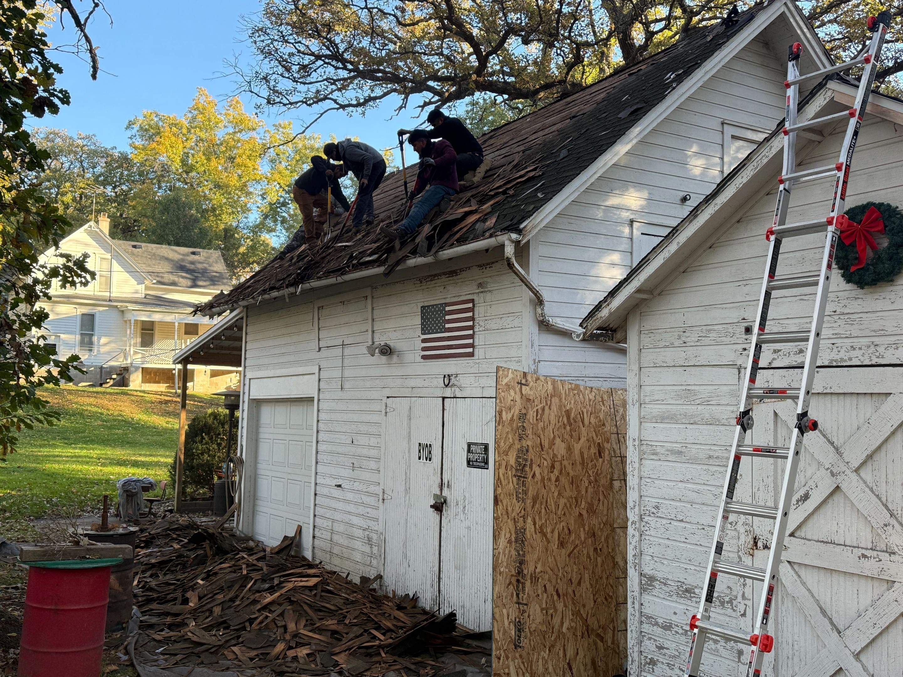 Garage Roof Replacement and Gutter Guard Installation in Red Oak by Star Home