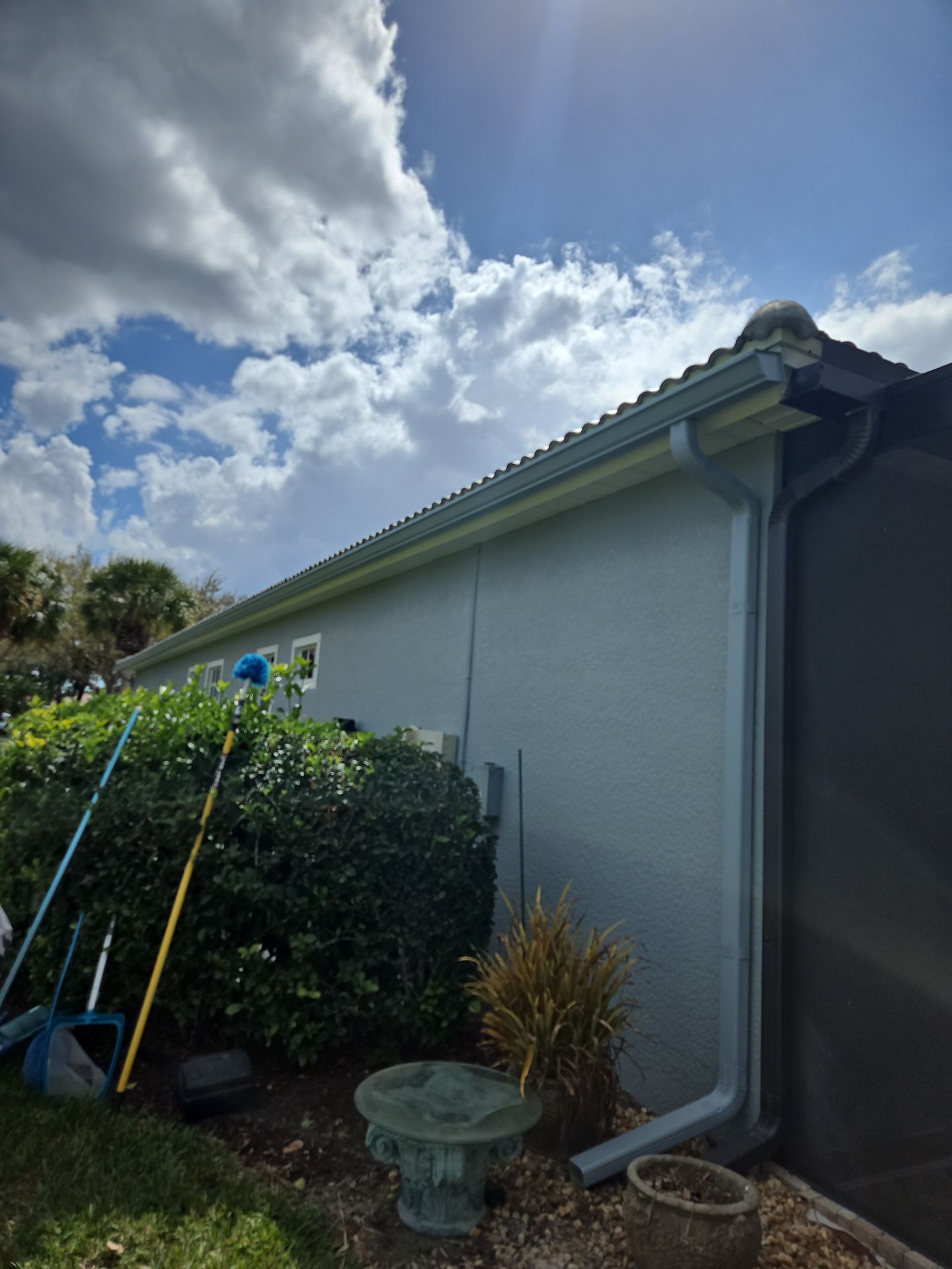 6-inch K-style Seamless Gutters and Splash Guard in Grey Color in Naples FL by Gutter Professors