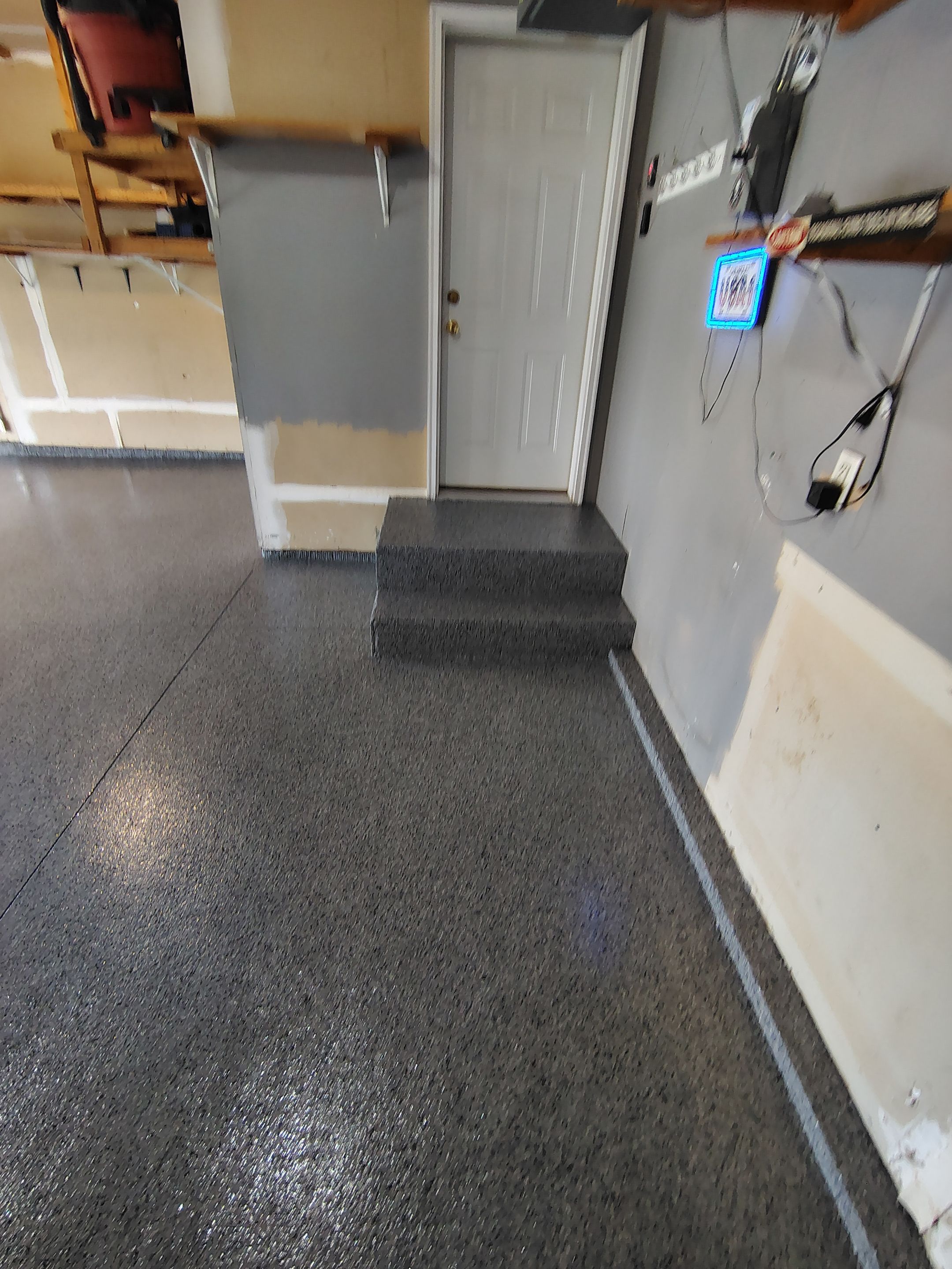 Nightfall Grey Speckled Epoxy Garage Floor Coating in Sioux Falls by Select Painting, Coatings & Garage Cabinets