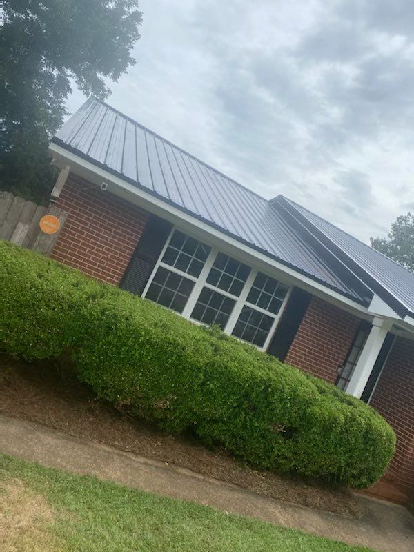 Standing seam metal roof installed by Whitt's Quality Roofing in Americus, GA