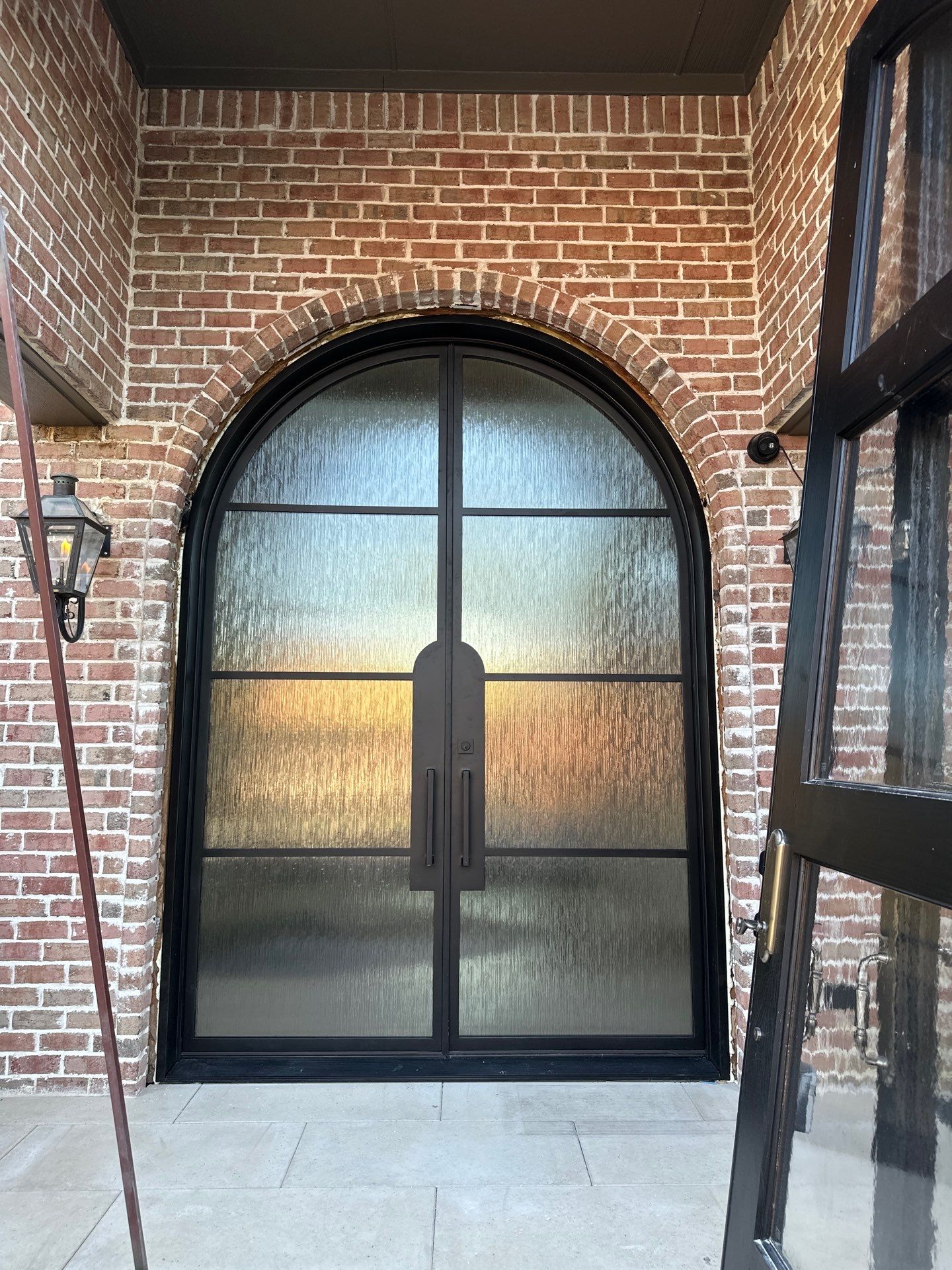 Custom Arched Metal Entry Door Installation in Plano by Solara Custom Living