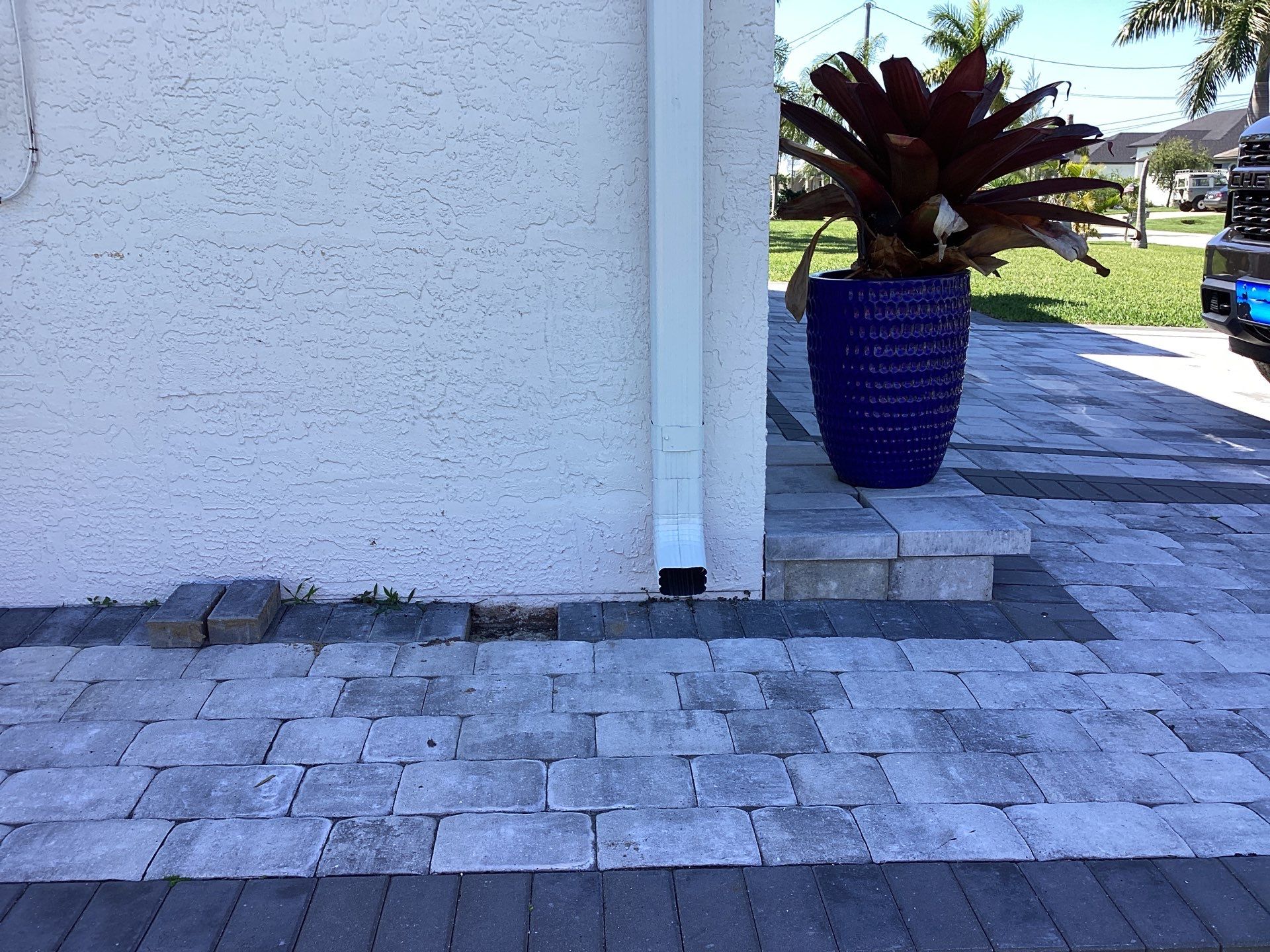 Brown Gutter + White and Brown Downspouts in Cape Coral FL by Gutter Professors