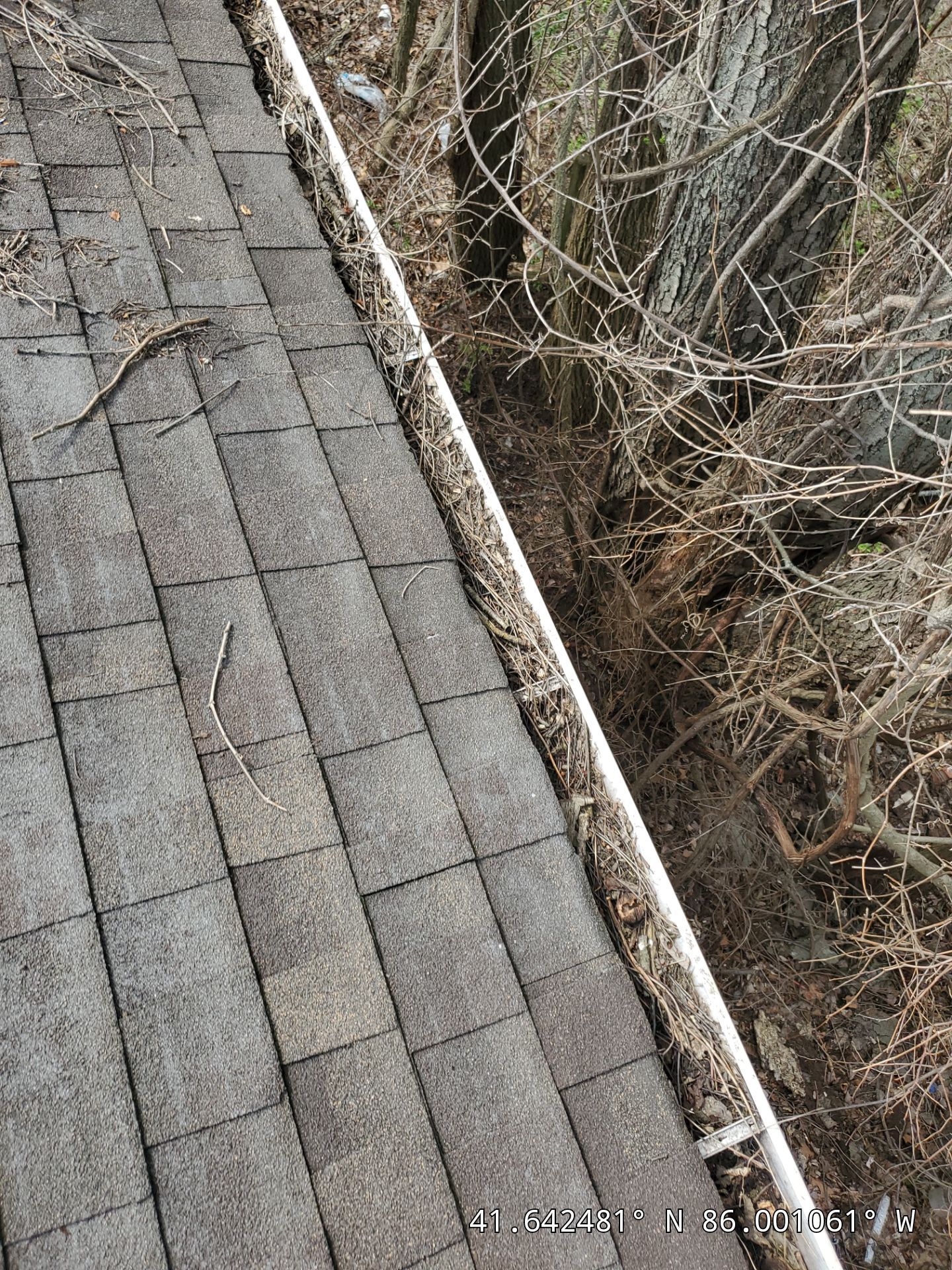Commercial gutter cleaning South Bend, IN before photo with filled gutters