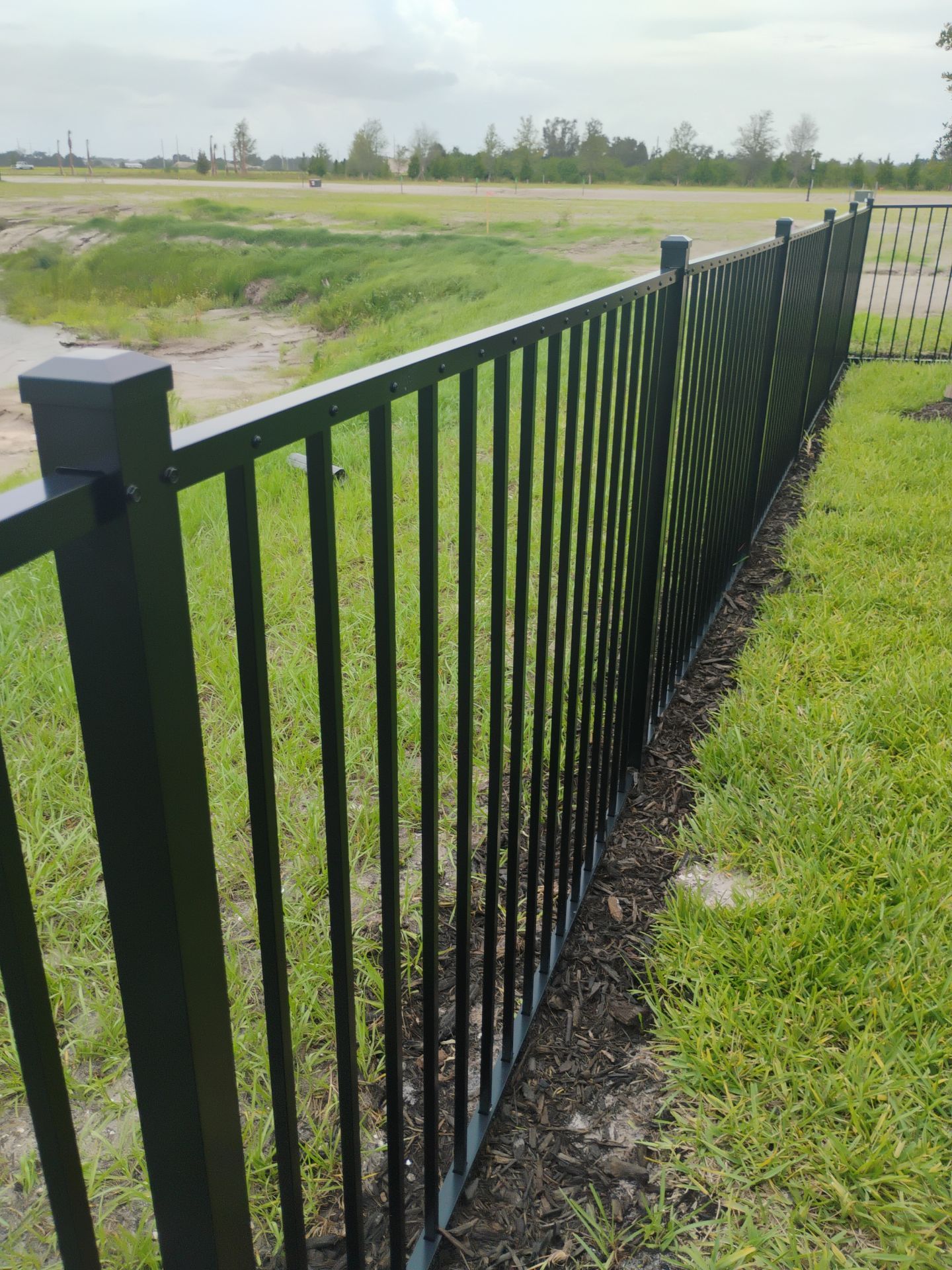 Black Aluminum Picket Fence Installation in Venice, Florida by True Fence LLC