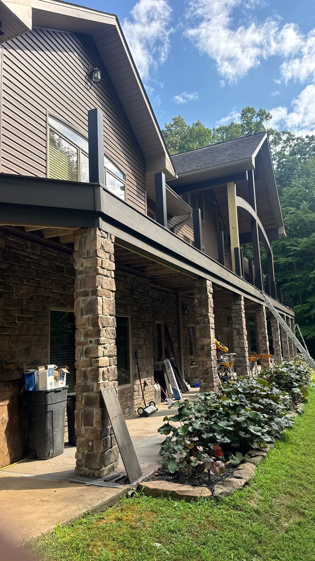 Custom Composite Deck Construction with Stone Pillars in Fayetteville by Walnut Hollow Decks & Outdoor Living