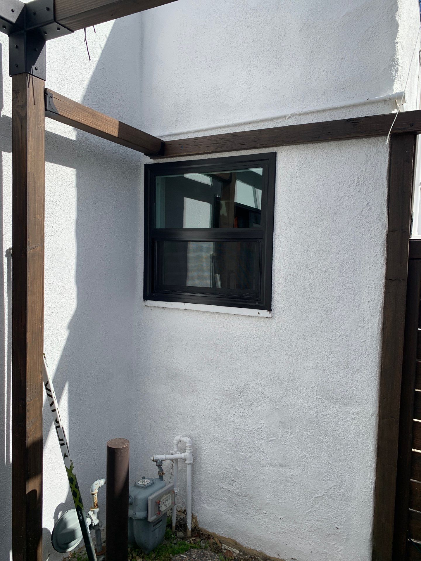Window Installation using Black Anlin windows by American Window Company