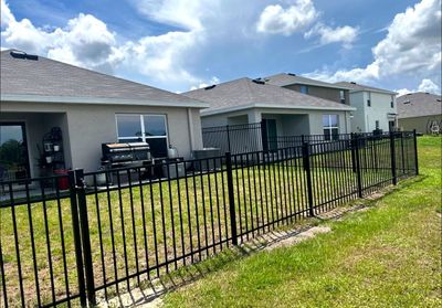 Aluminum Fence Installation using Black 3 Rail Aluminum Fence