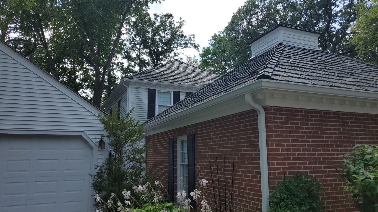 Housewashing  using Algaecide, soft wash soap by Northern Power Washing LLC.