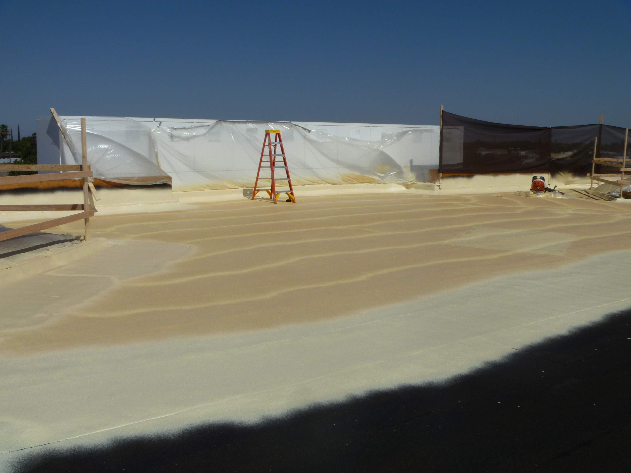 Commercial Roofing Installation using Spray foam and Conklin Benchmark/PUMA XL 18 yr warranty coatings by Straight Edge Roofing Inc