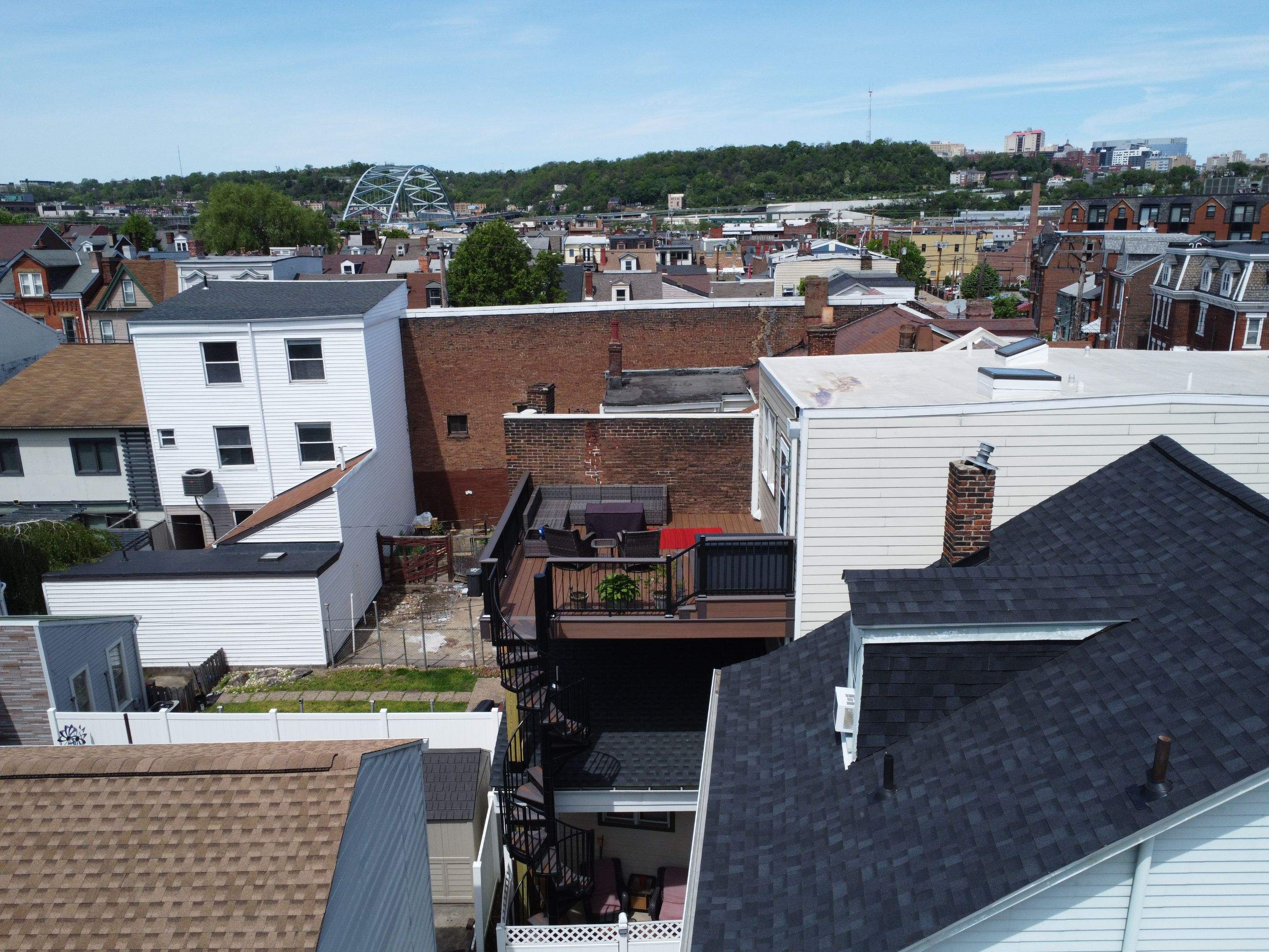 Elevated Multi-Level Composite Deck with Spiral Staircase in Pittsburgh by Cousins Roofing Siding & Decks