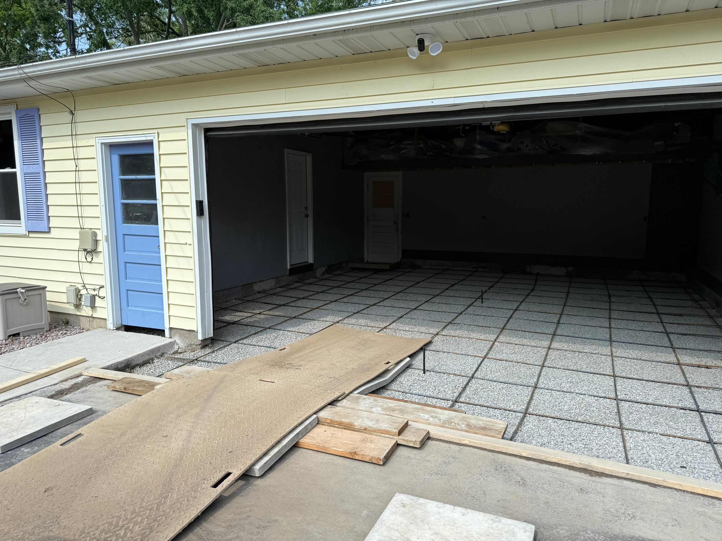 Concrete garage floor replacement and epoxy coating installed by NG Masonry & Construction LLC