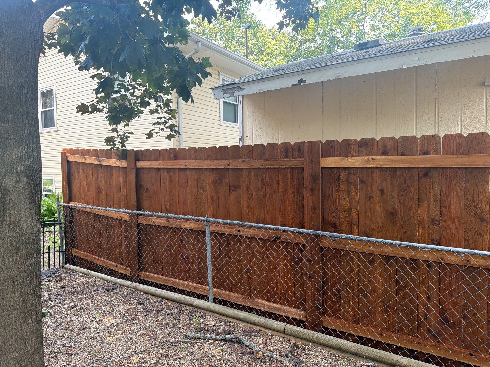 Pecan Cedar Privacy Fence Installation with Scalloped Top in Cedar Falls by Perfect Picket Fence and Stain