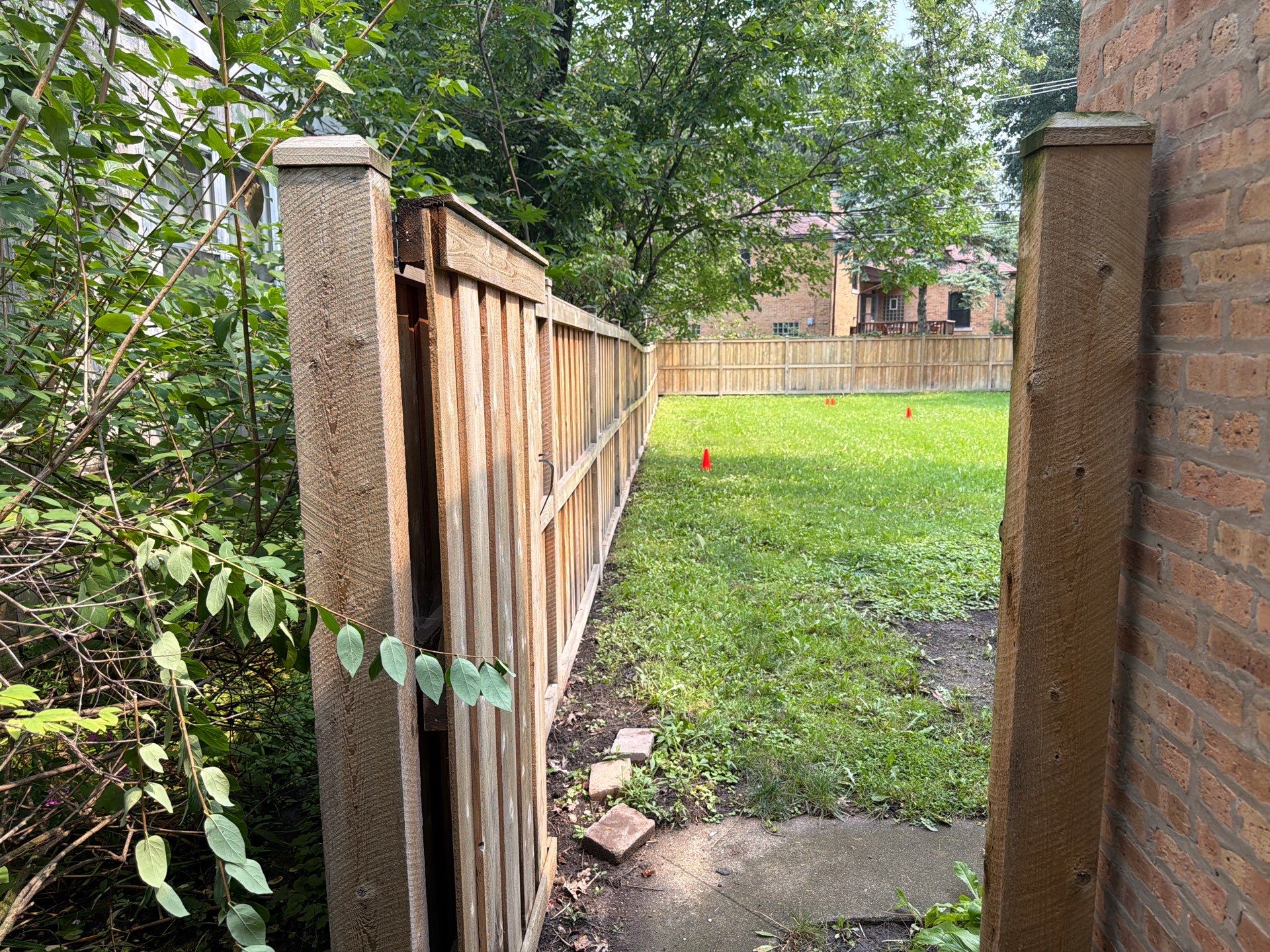 Wood fence cleaning and sealing by Northern Power Washing LLC.