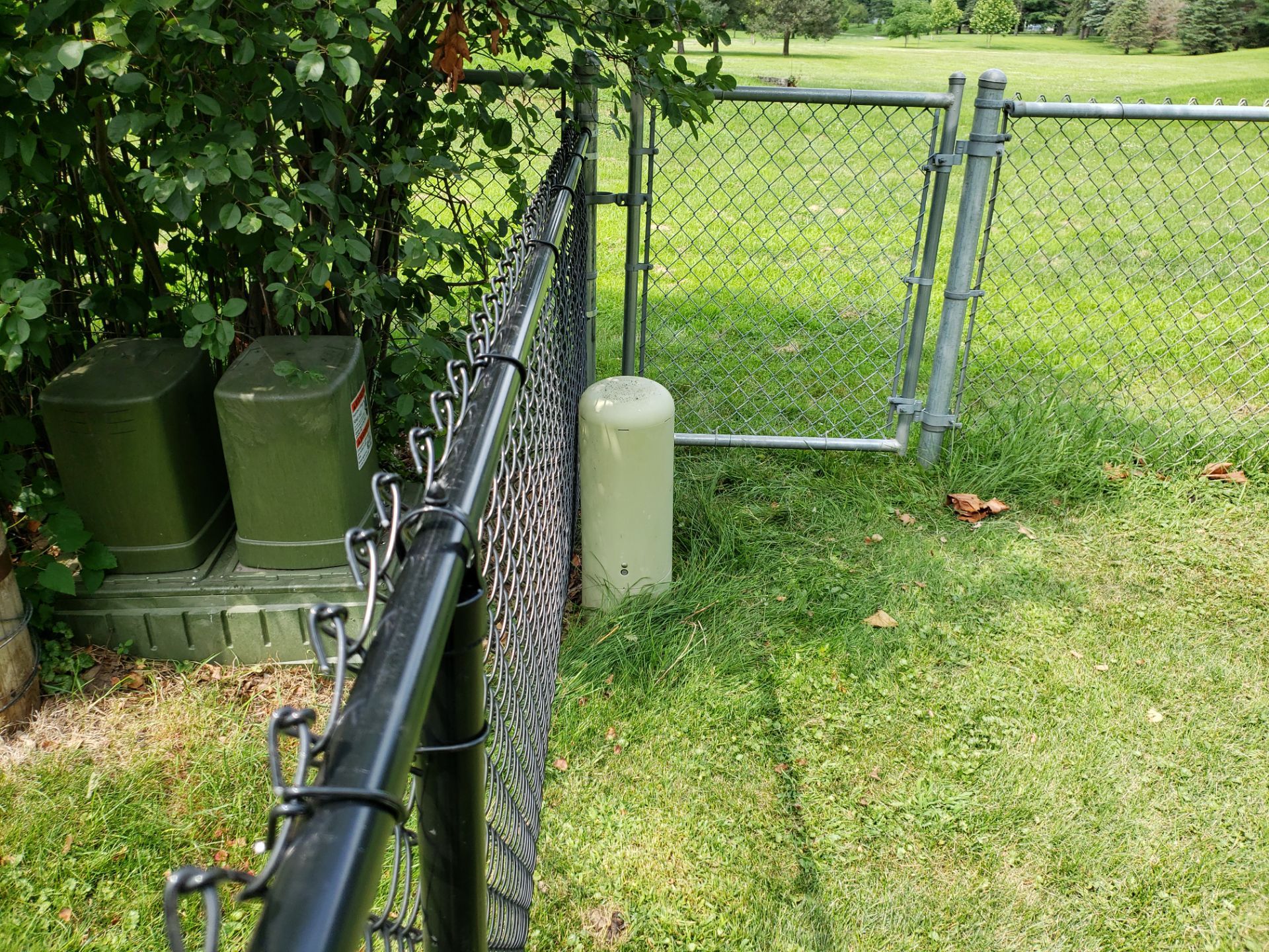Black Chain Link Fence Installation in Cedar Falls by Perfect Picket Fence and Stain