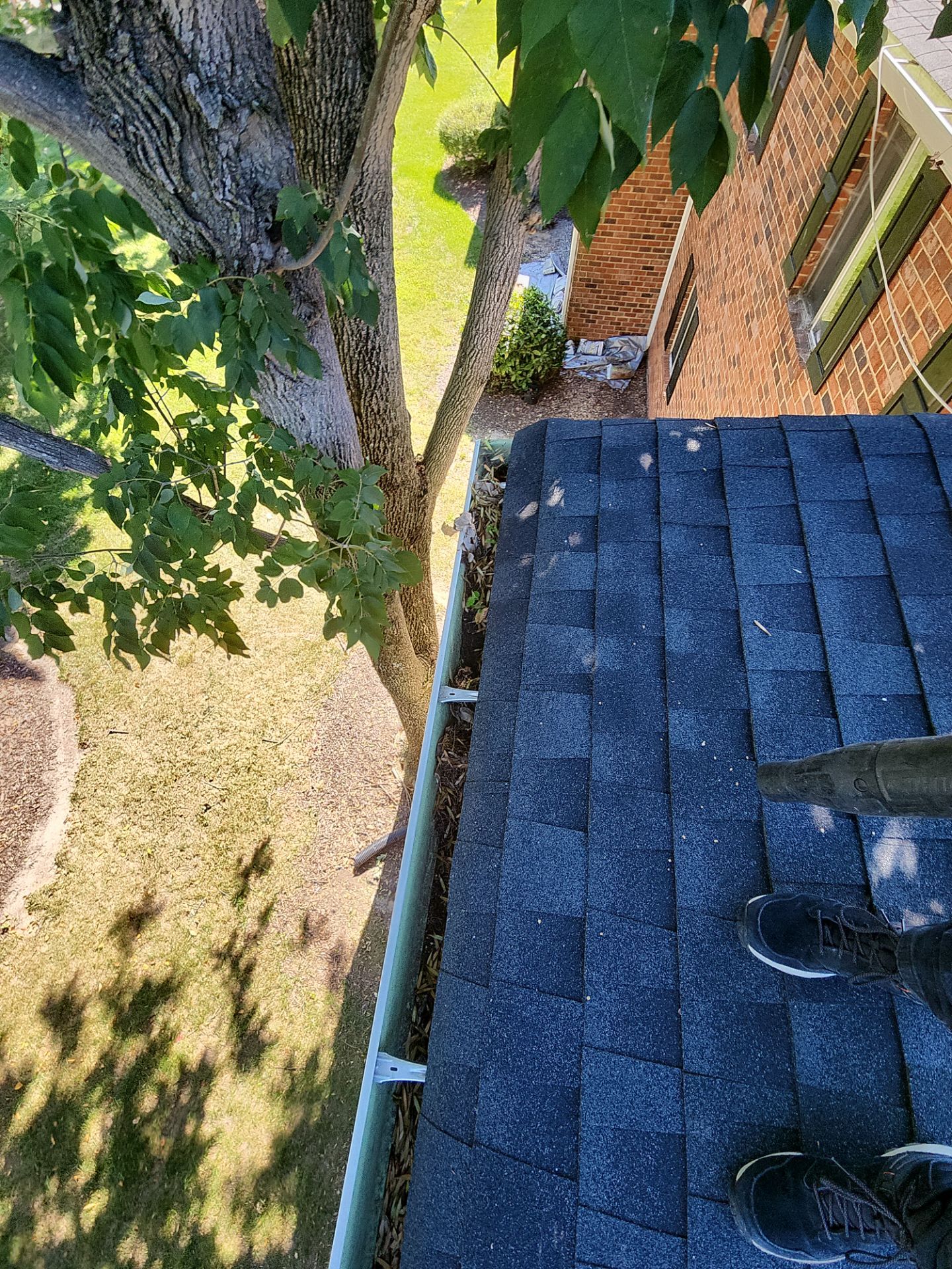 Commercial gutter cleaning Henrico before photo with filled gutters