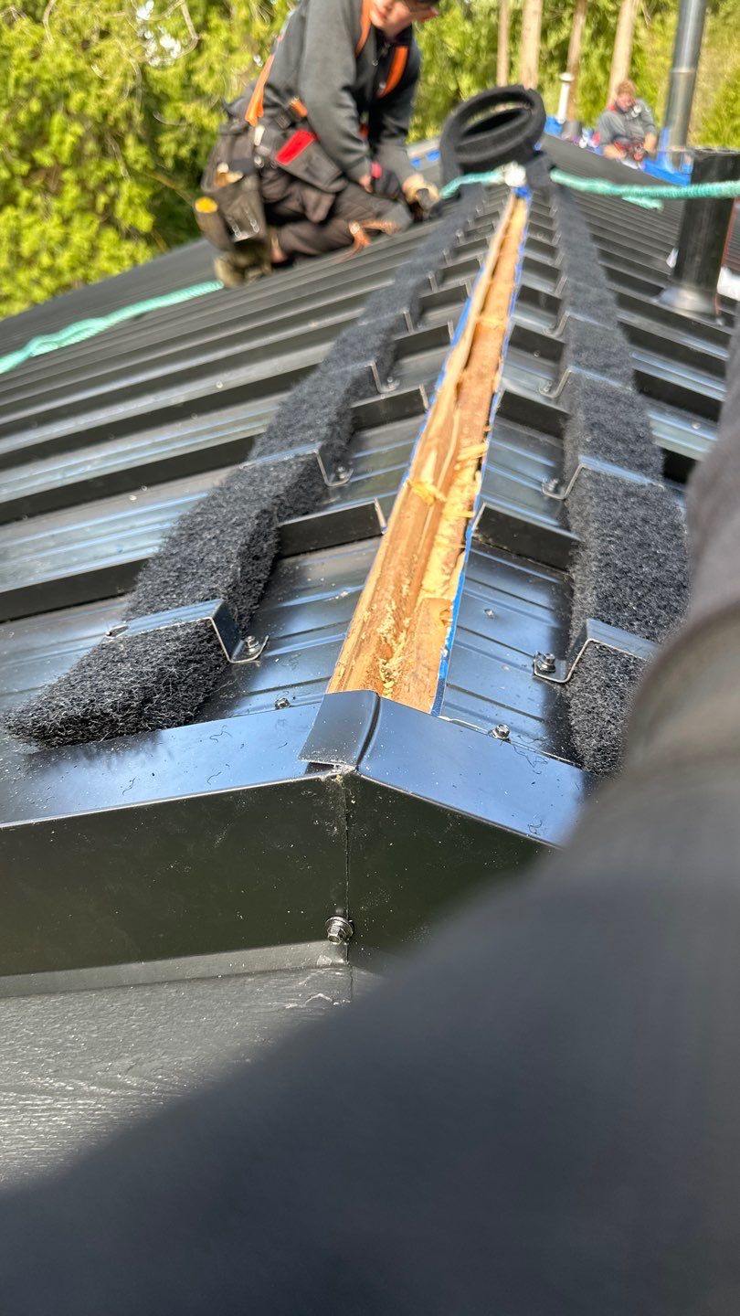 Residential ReRoofing Installation using 12" Prolok metal by Top Notch Roofing Inc