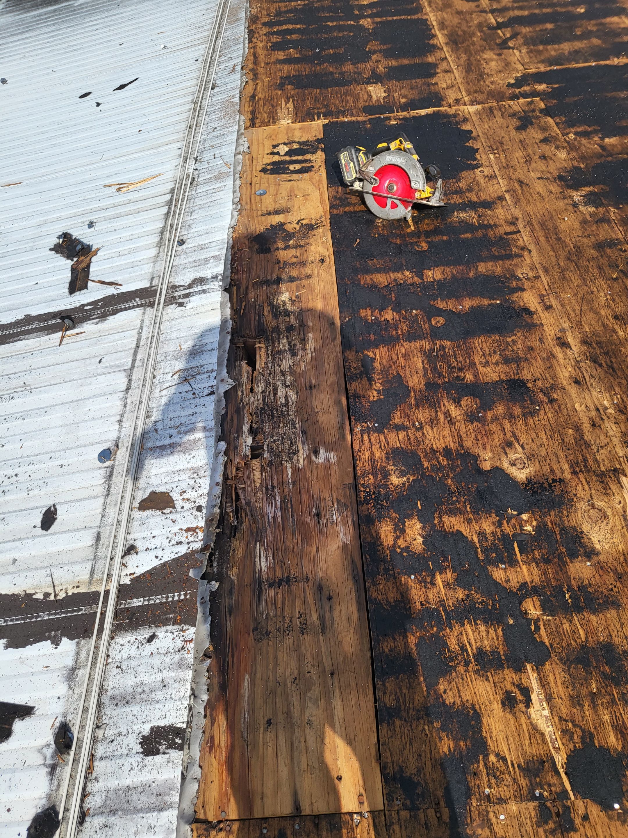 Standing Seam Metal & Flat Re-Roof using 1.5" Nail Strip 24ga Black Matte Kynar Coated Standing Seam Metal Panels by Morton Roofing, Inc.
