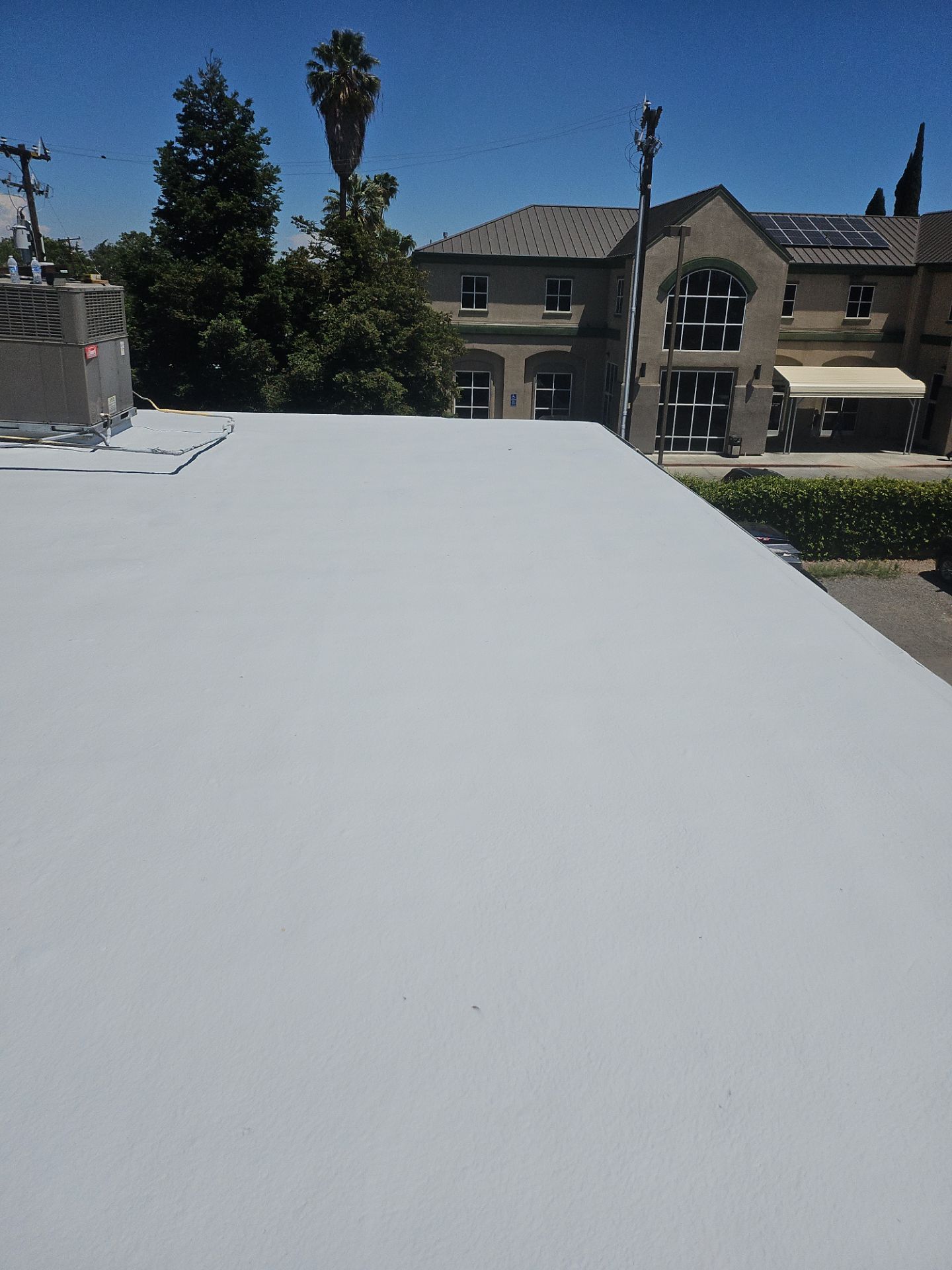 Foam Refurbish using General Coatings acrylic coatings and spray foam by Straight Edge Roofing Inc
