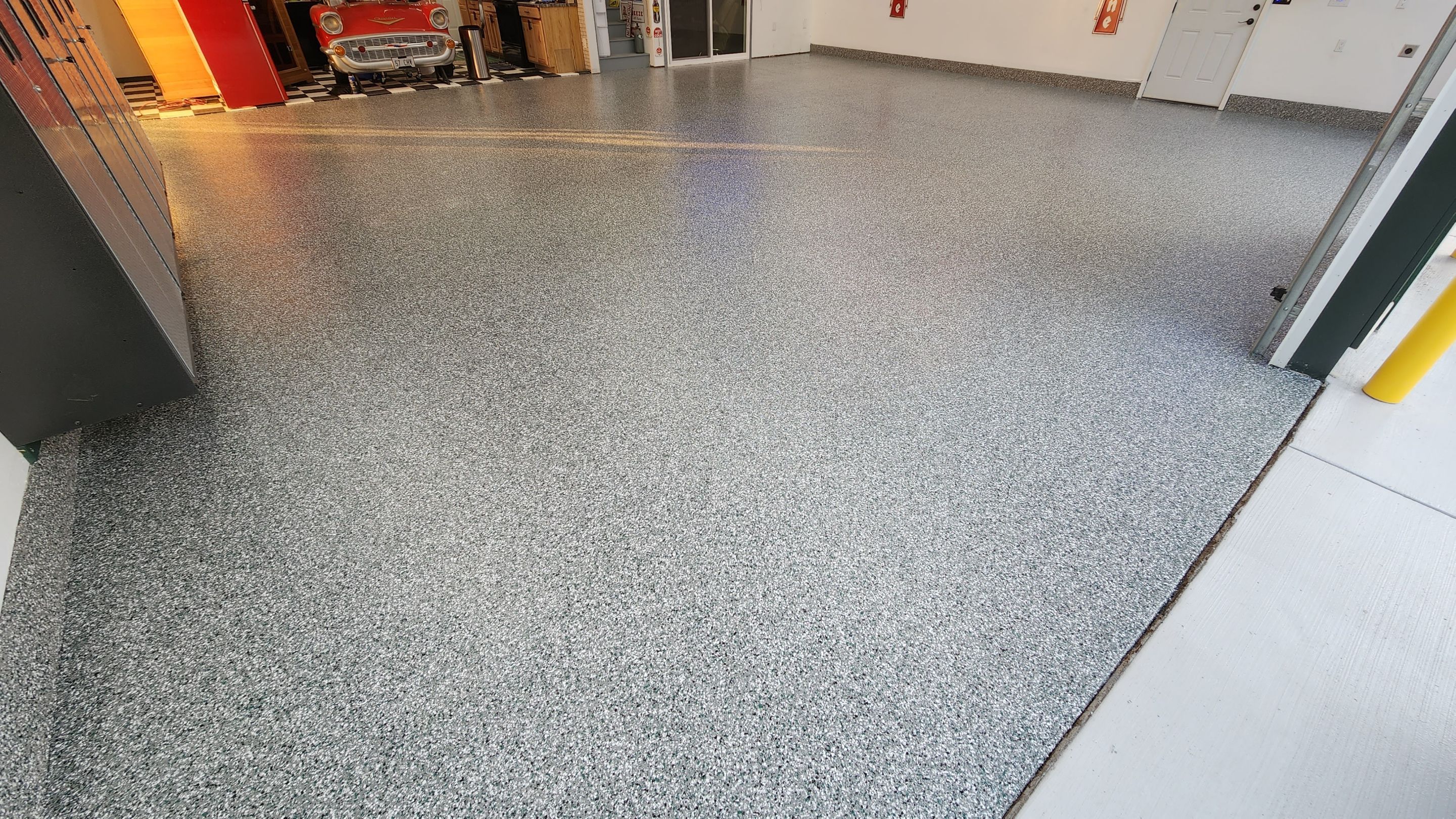 Garage Transformation using Domino with Blue by Croc Coatings, LLC