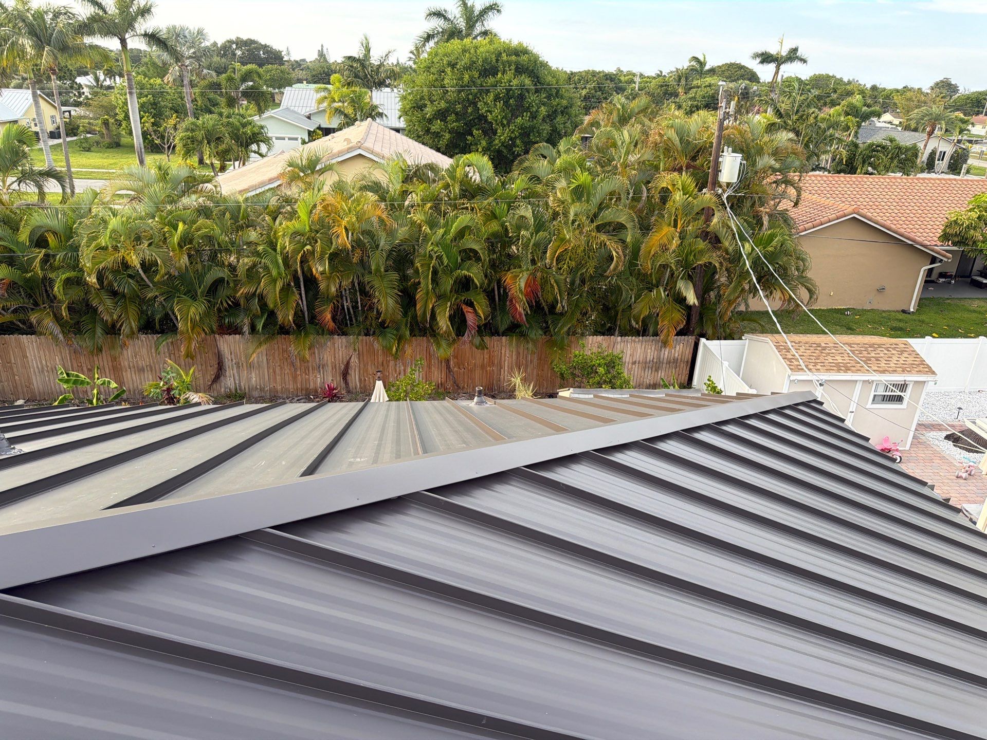 Residential Roofing Installation using 1.5'' Mechanical Seam by BLUES BROTHERS ROOFING