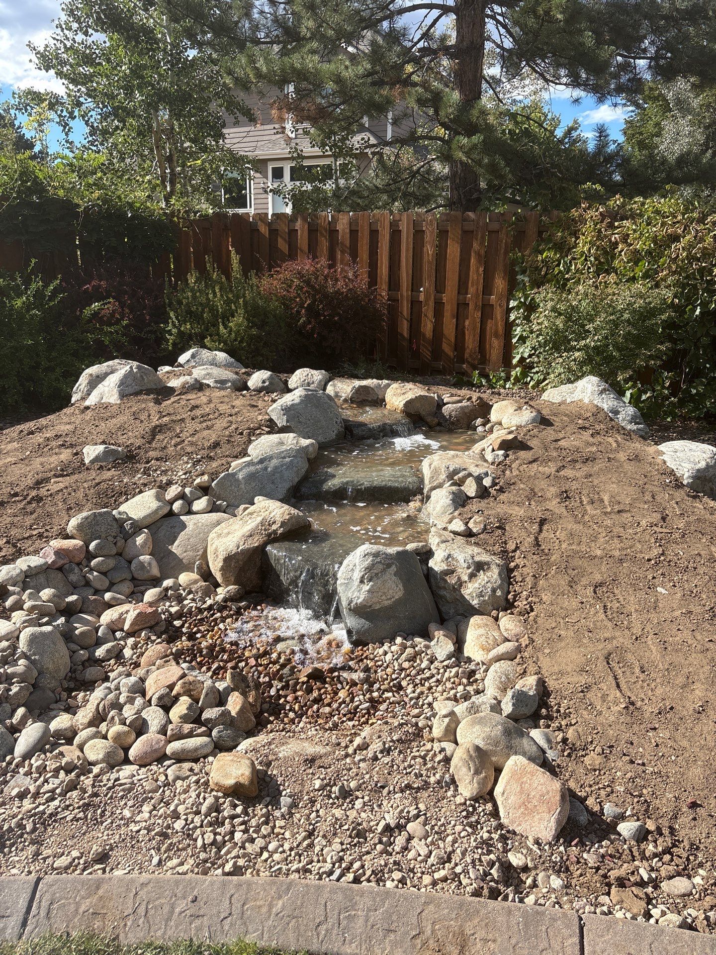 Pondless in Arvada by JRM landscape & design